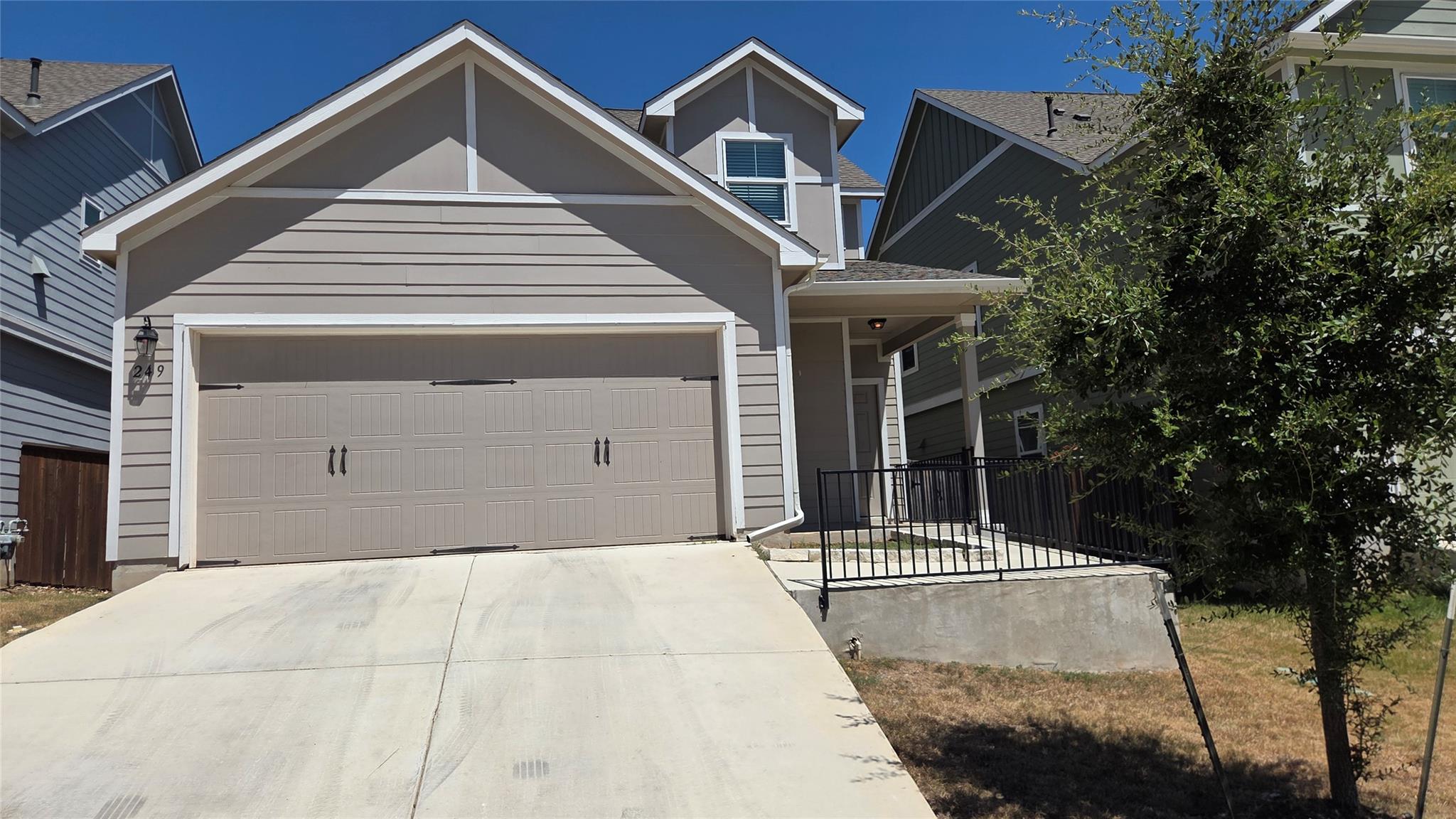Modern multi-level siding exterior featuring an a