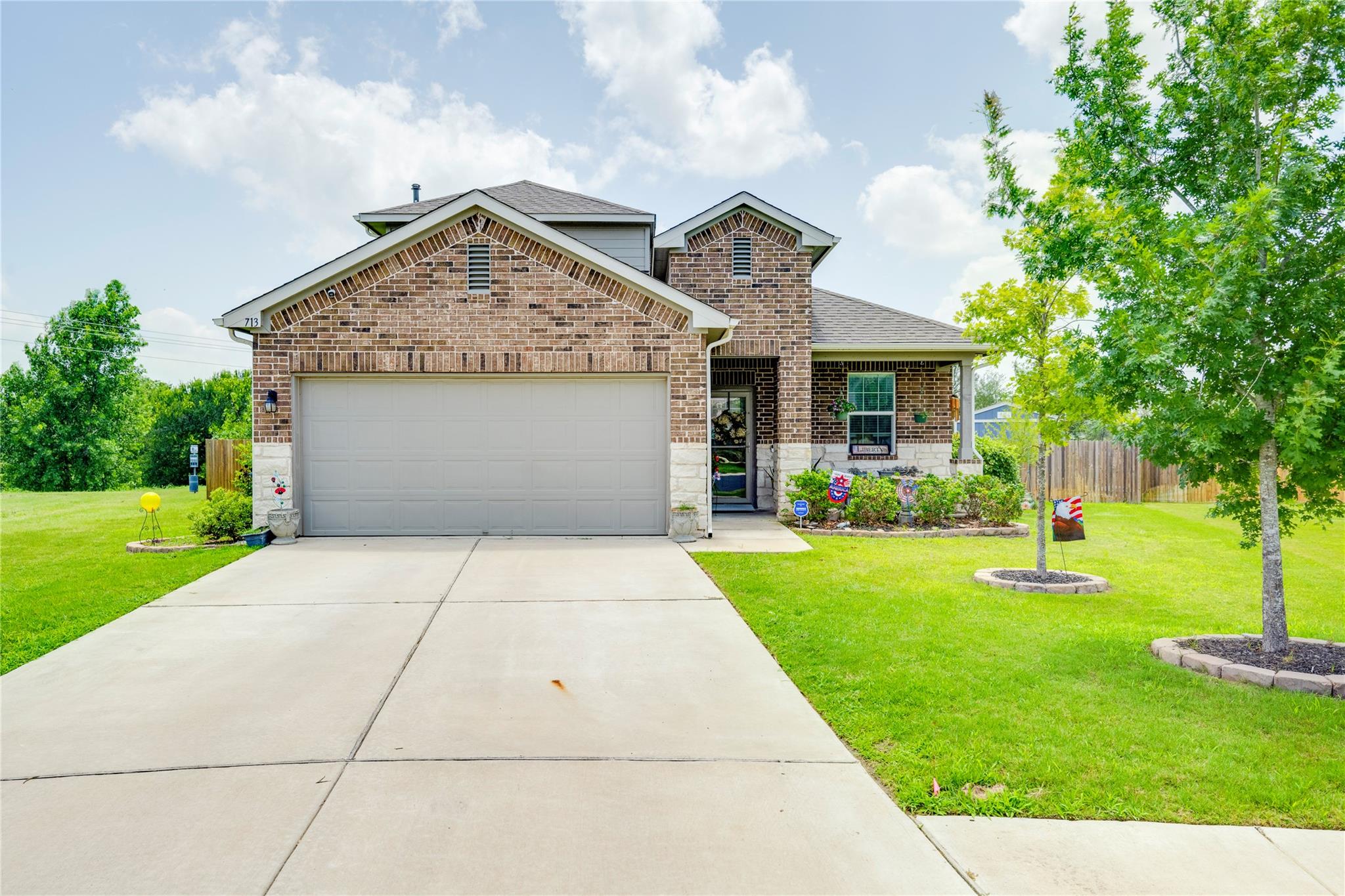 A classic brick facade welcomes you home, complet