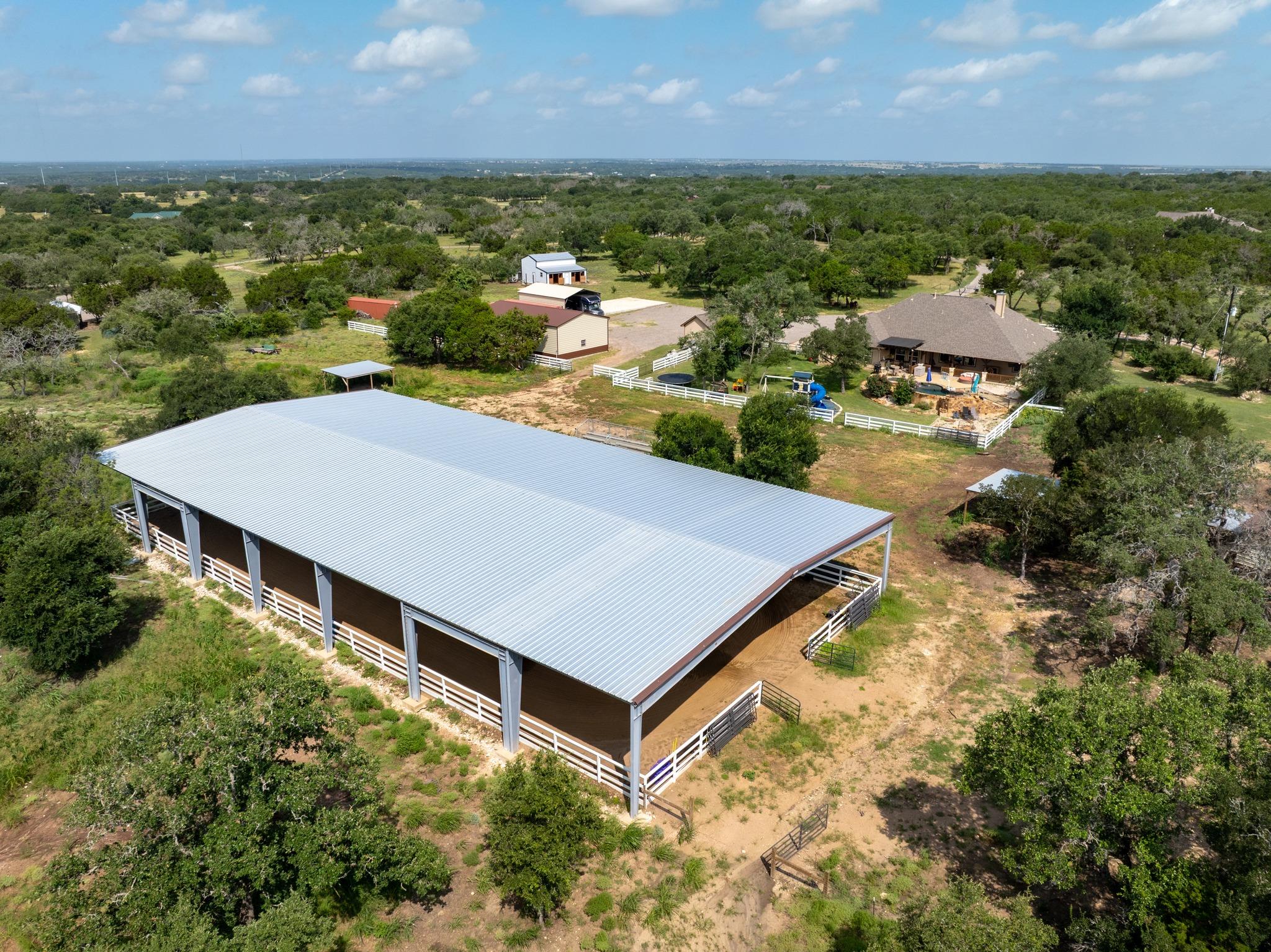 An aerial panorama reveals a vast equestrian aren