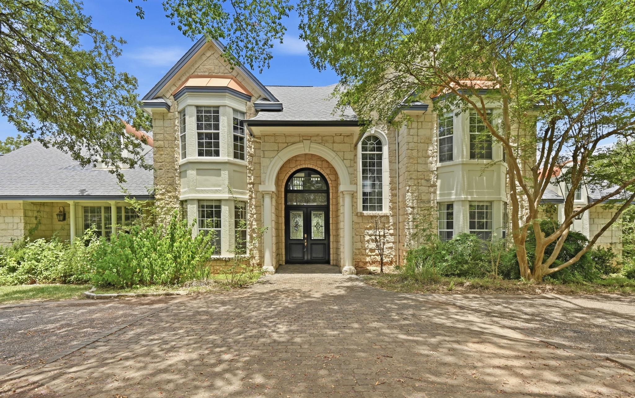 Elegant stone masonry defines the grand entryway 