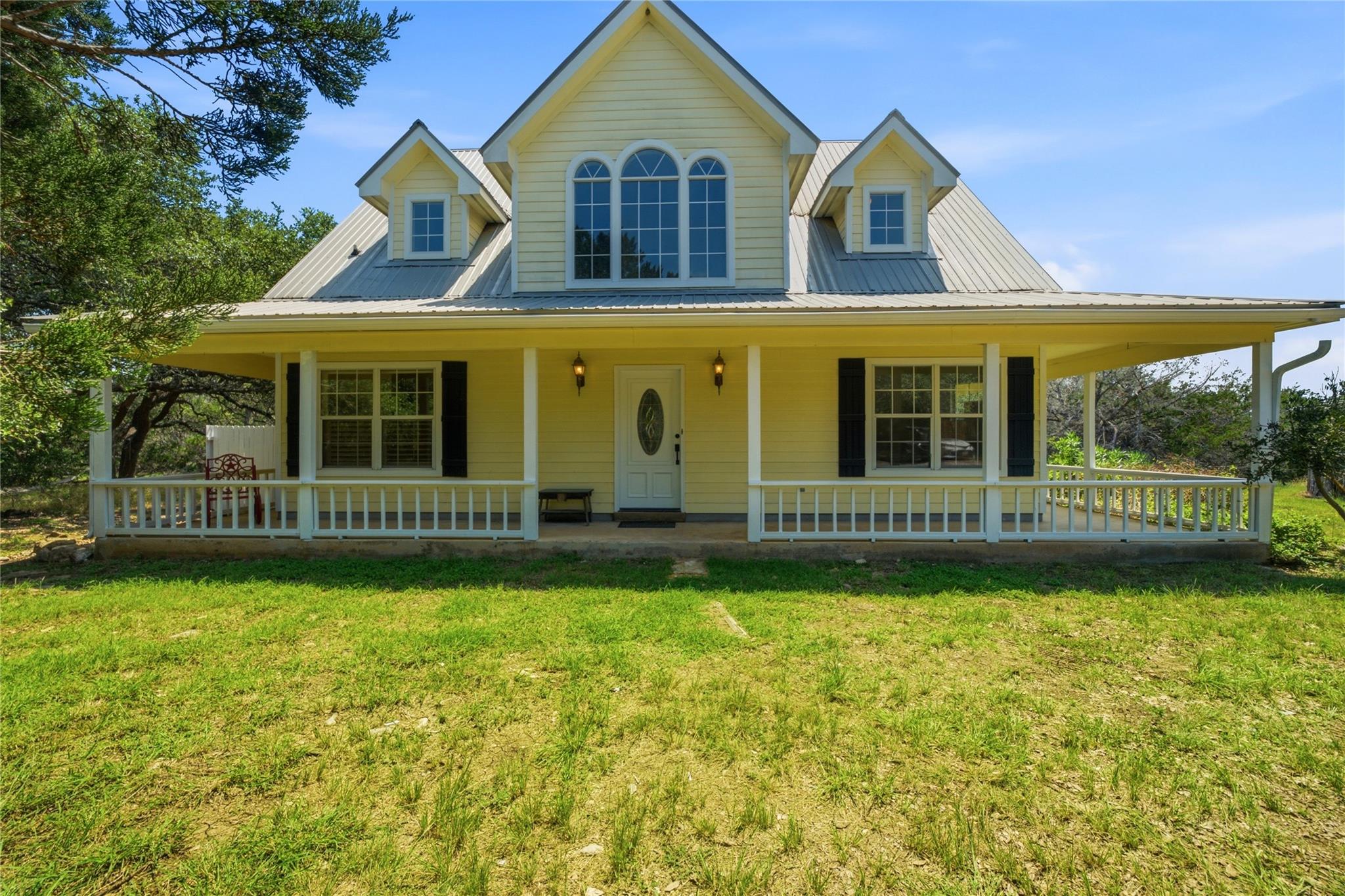A spacious covered porch welcomes you to this inv