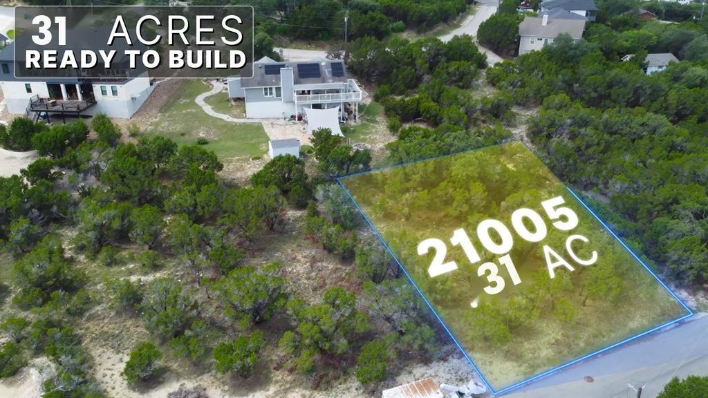 A generous, naturally wooded parcel awaits your c