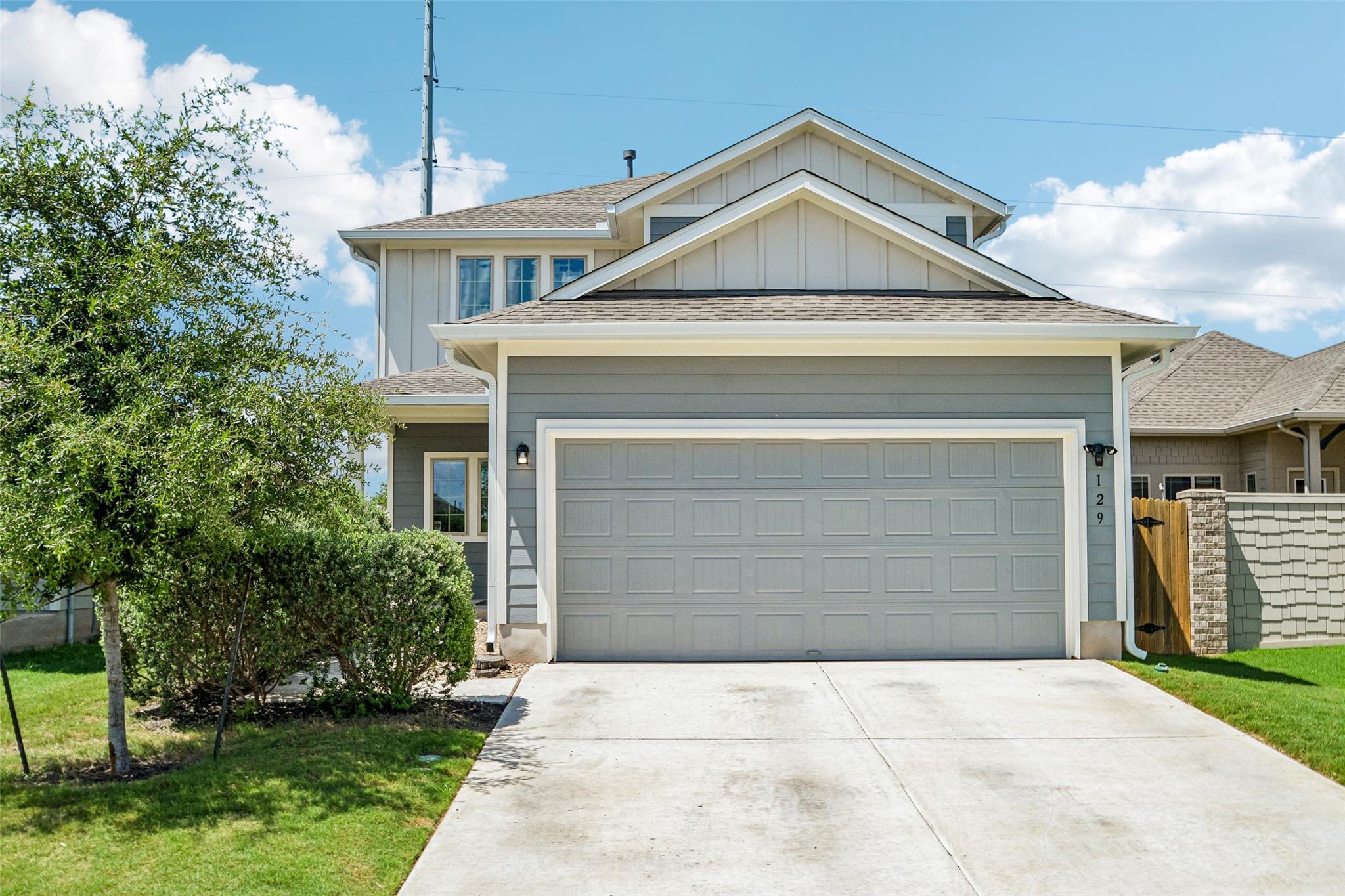 A welcoming facade with a spacious driveway and a