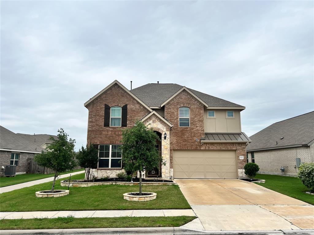 A classic brick exterior with well-maintained lan