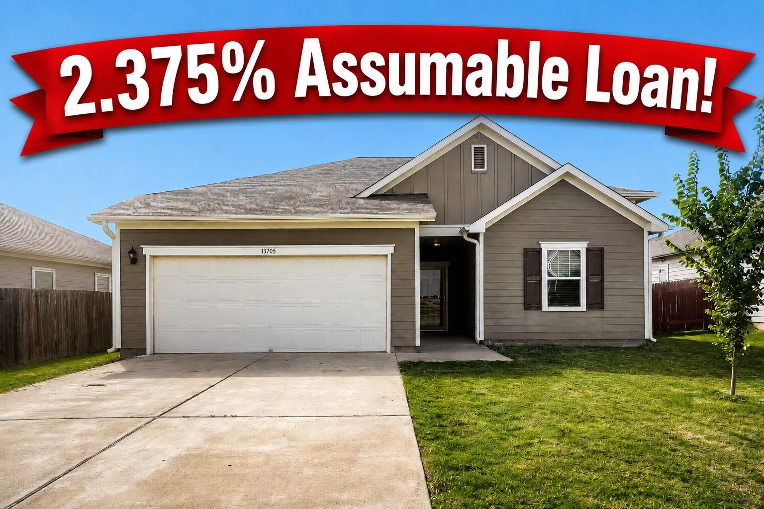 A neatly maintained front yard complements this r