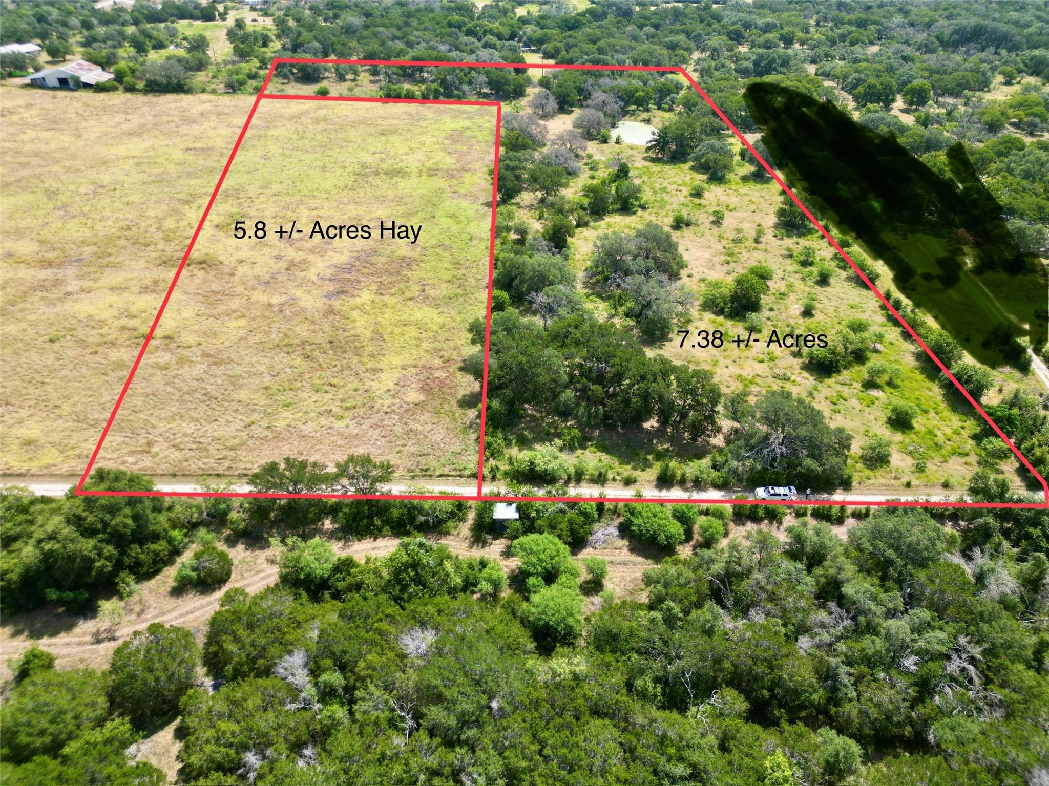 An aerial perspective reveals generous acreage fe