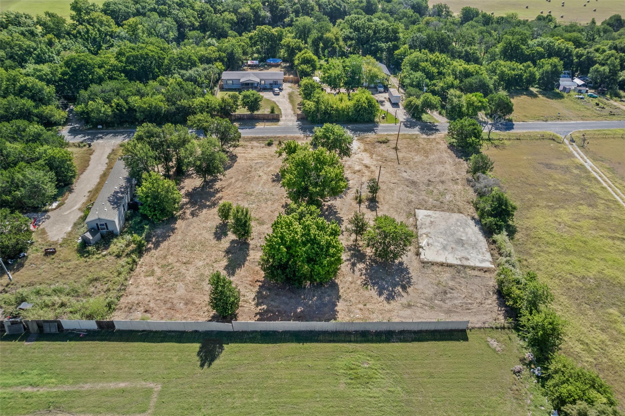 A spacious, cleared lot offers ample opportunity 