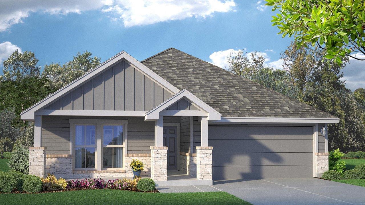 An inviting front entry welcomes guests to this a