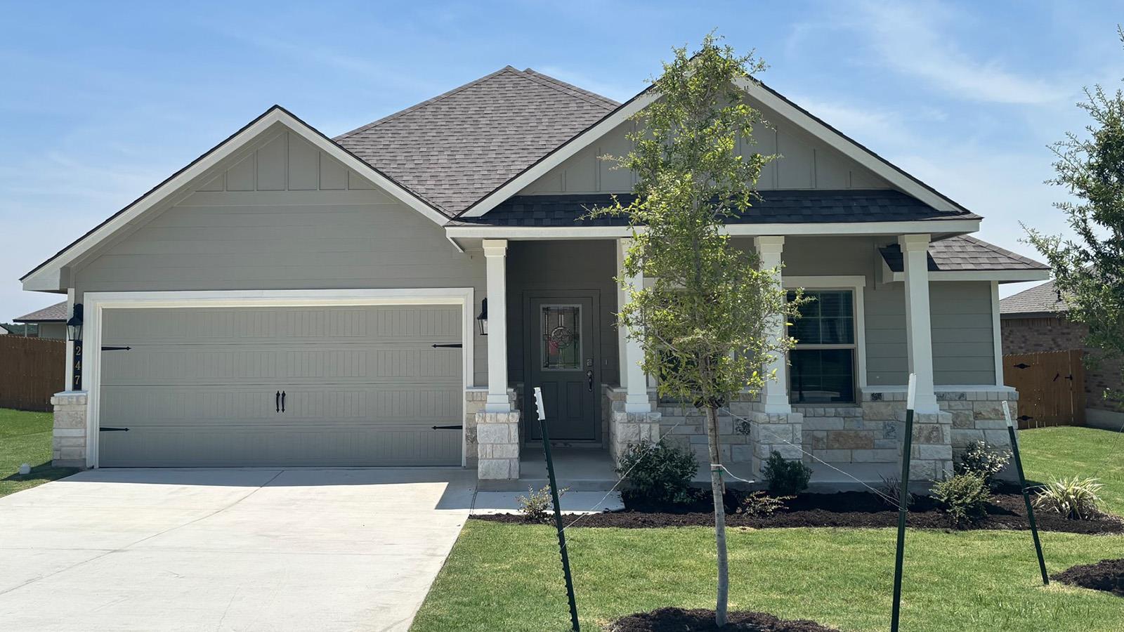 Craftsman details and classic stone accents defin