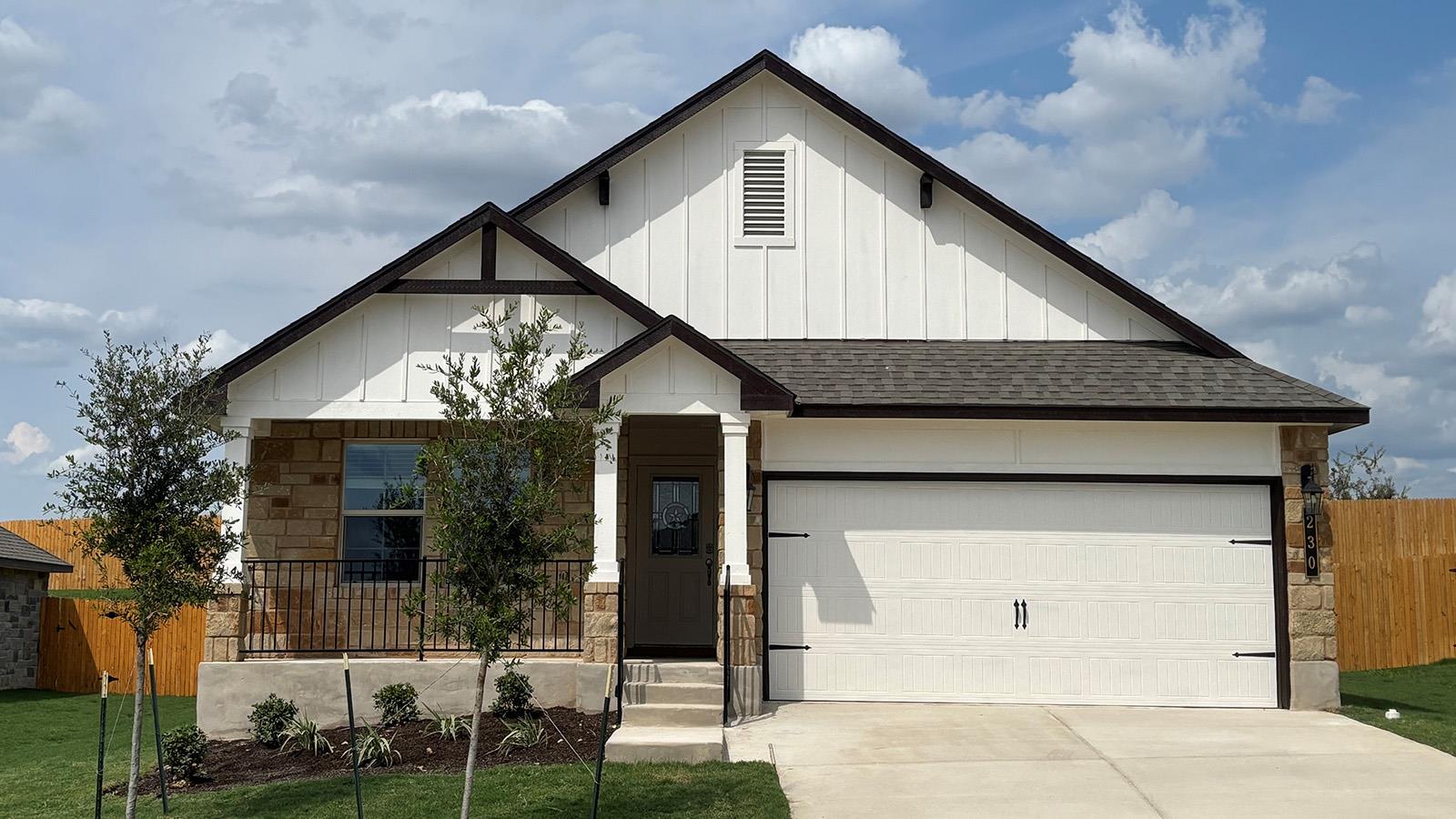 Craftsman details and native stone accent this mo