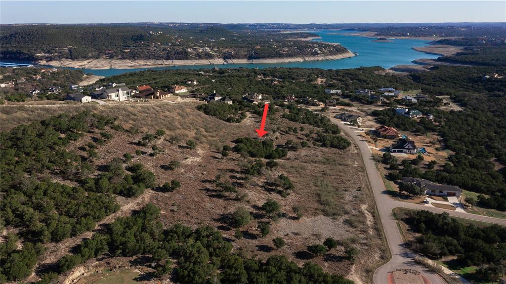 Perched on a verdant hillside, this lot offers sc