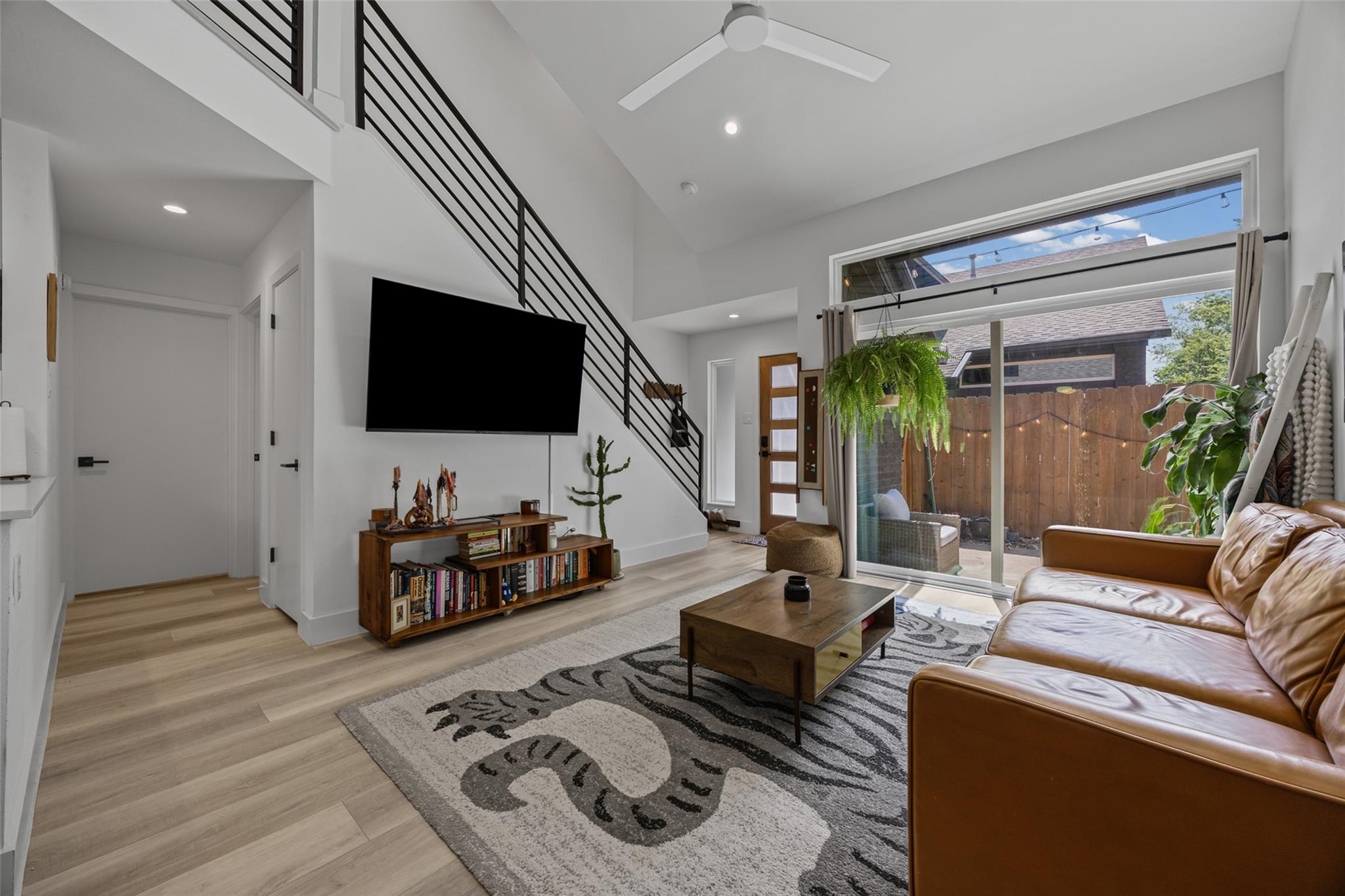 A living space with high ceilings and an open flo