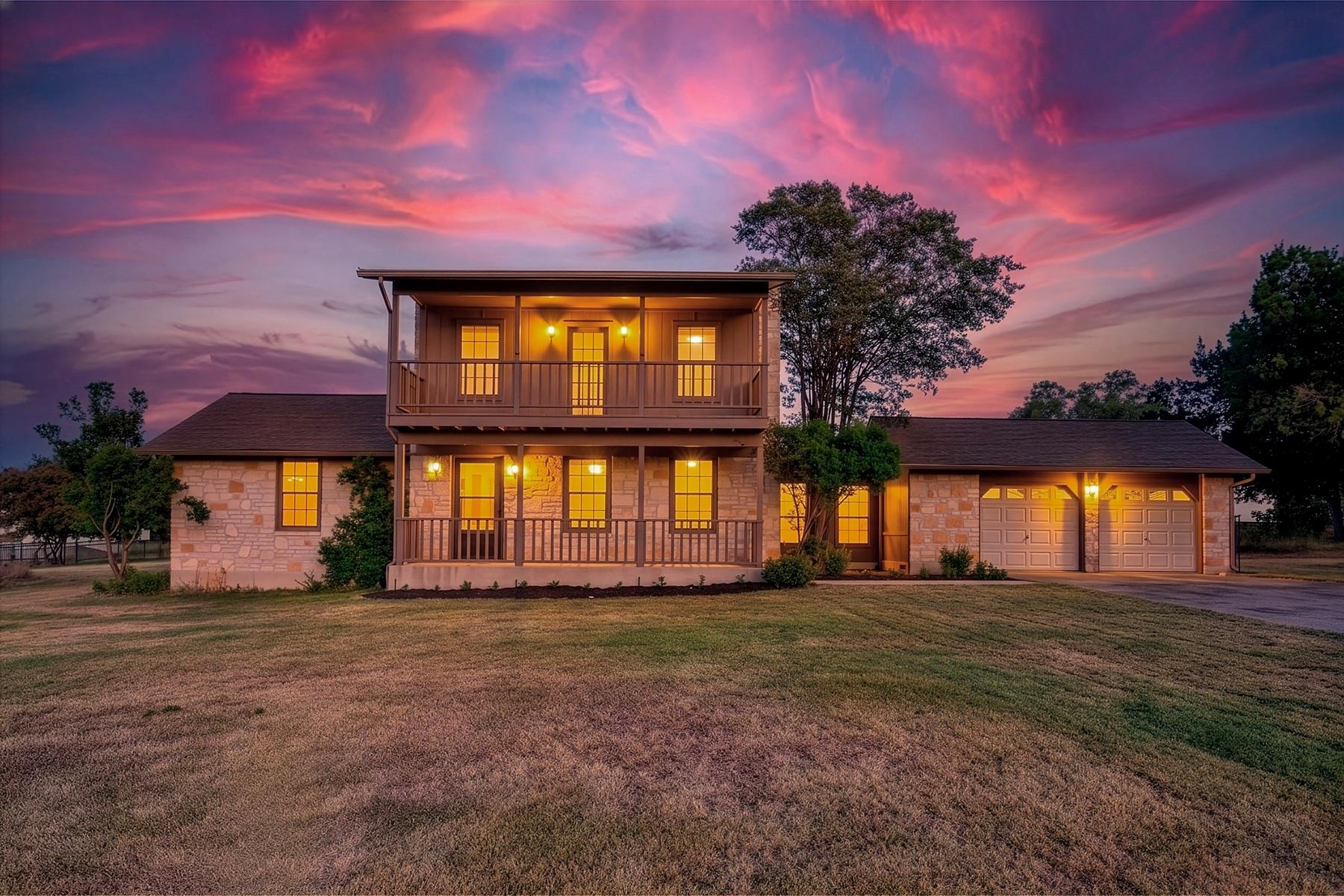 Dramatic sunset hues backdrop this stone-clad res
