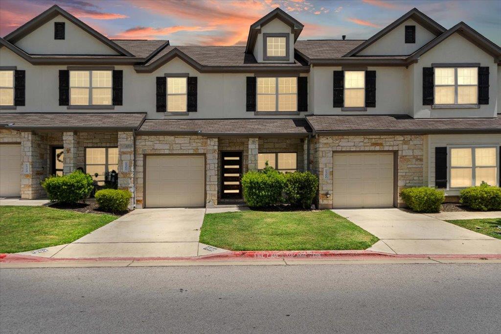 Stone and stucco exteriors with individual garage