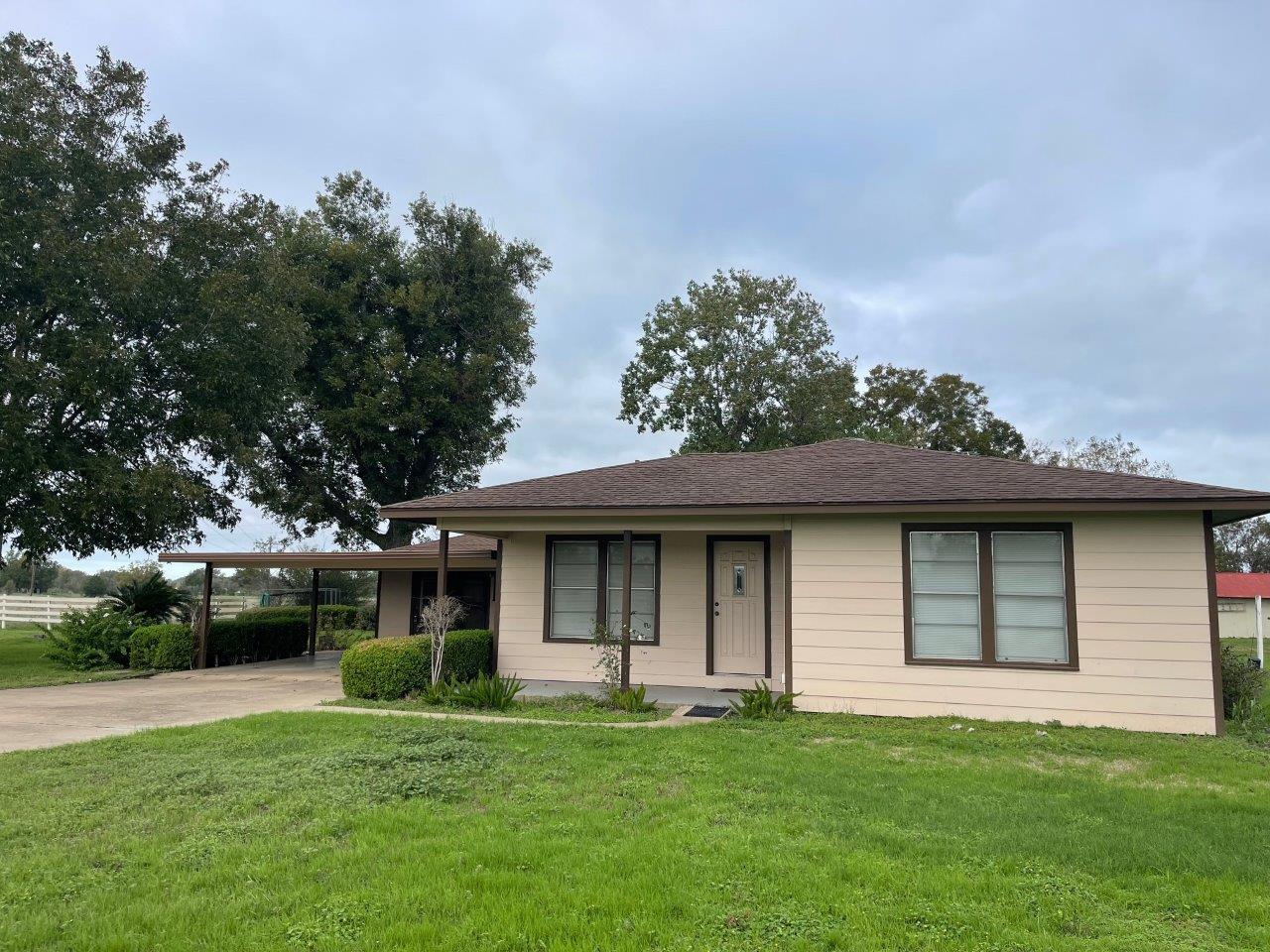 A modest home with inviting curb appeal, featurin