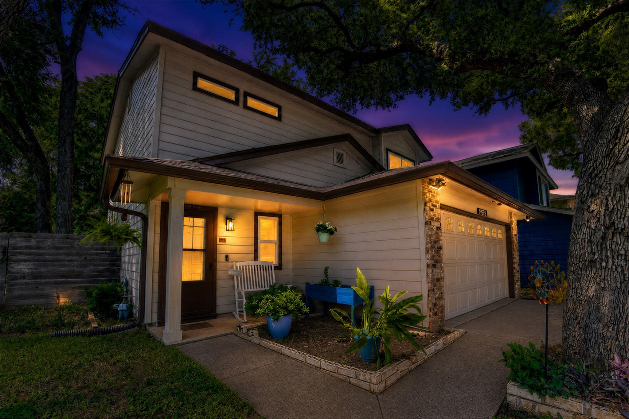 Illuminated entryway with an attached garage, sho