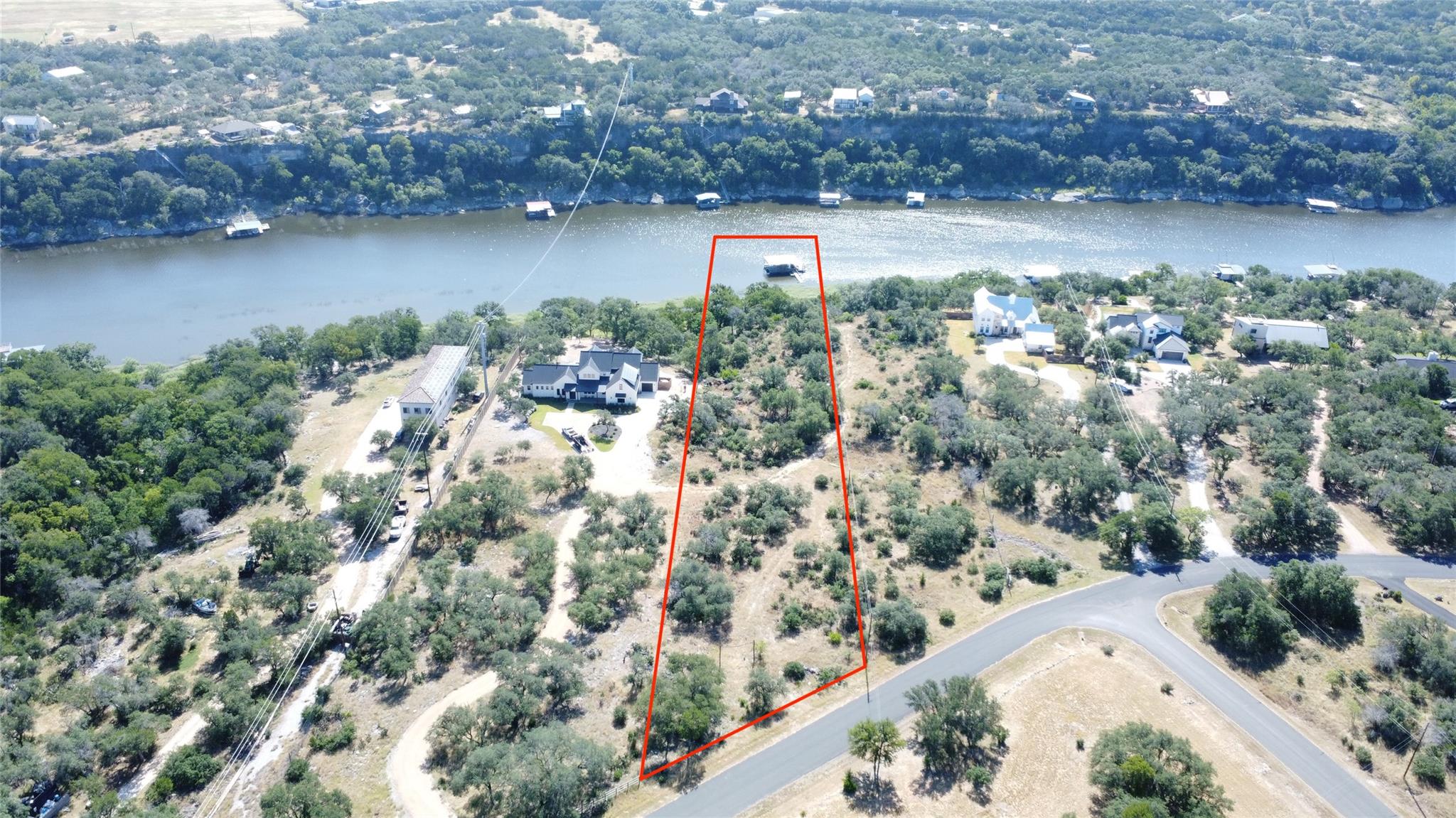 A prime lakeside lot offers direct water access a