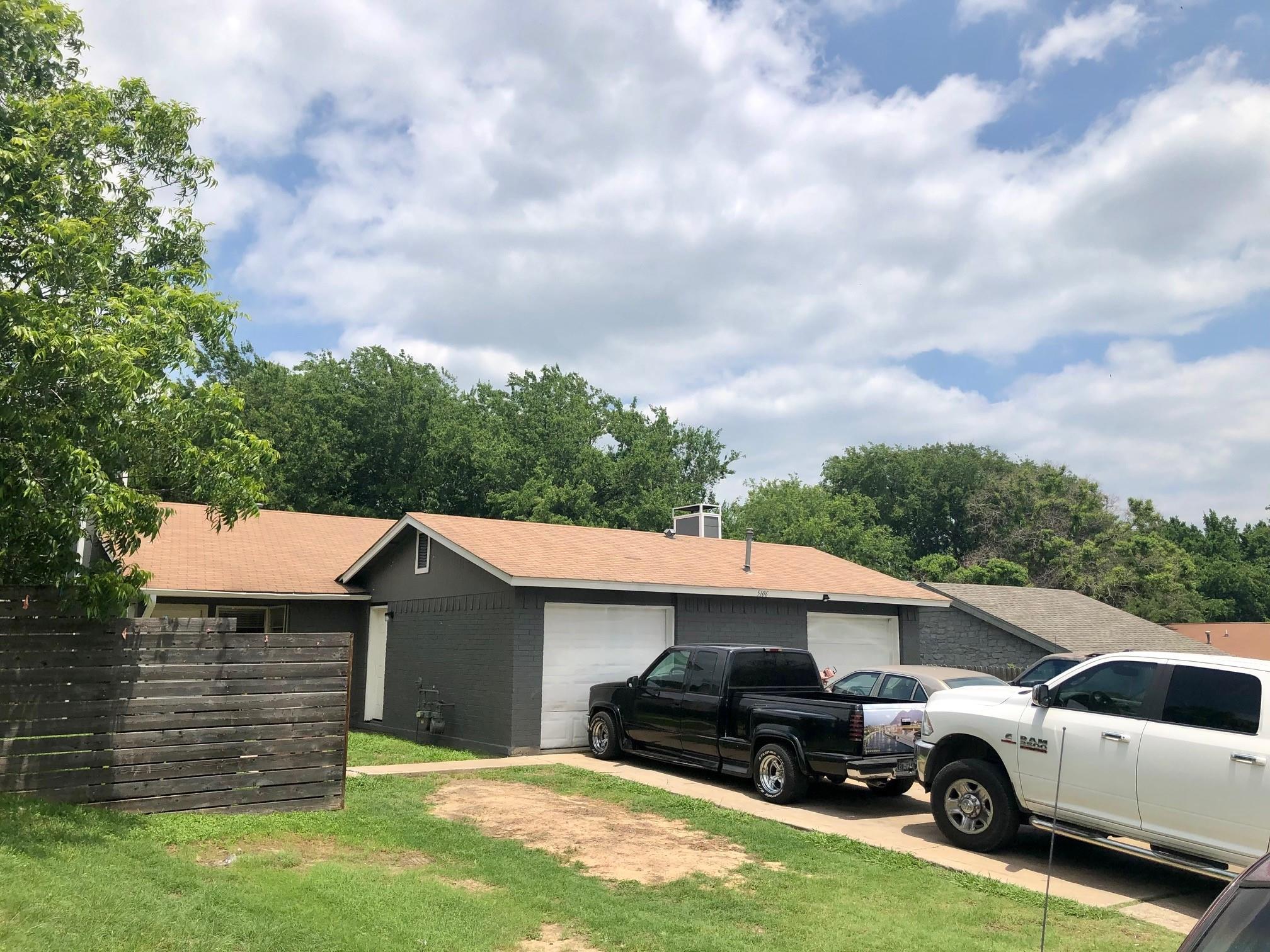 A classic facade with dual garages offers conveni