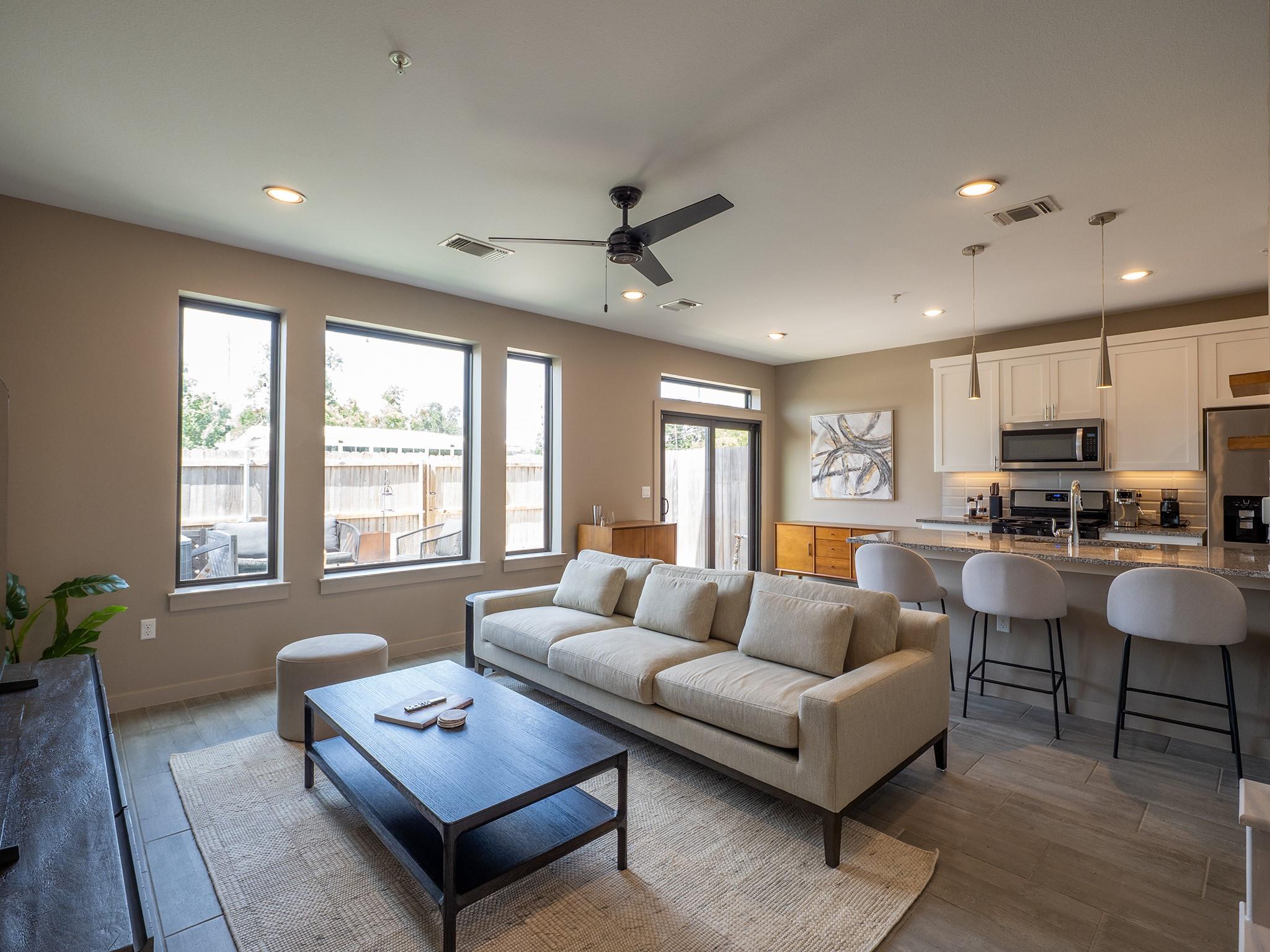 An open concept living area boasts a modern kitch