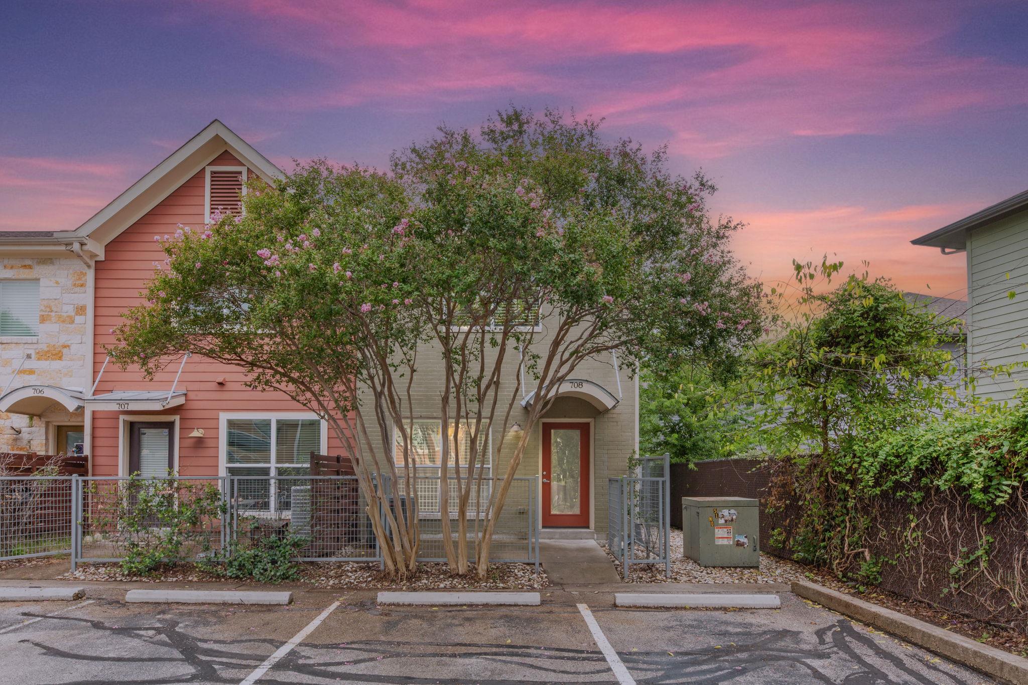 A vibrant sunset hues over a welcoming residence 
