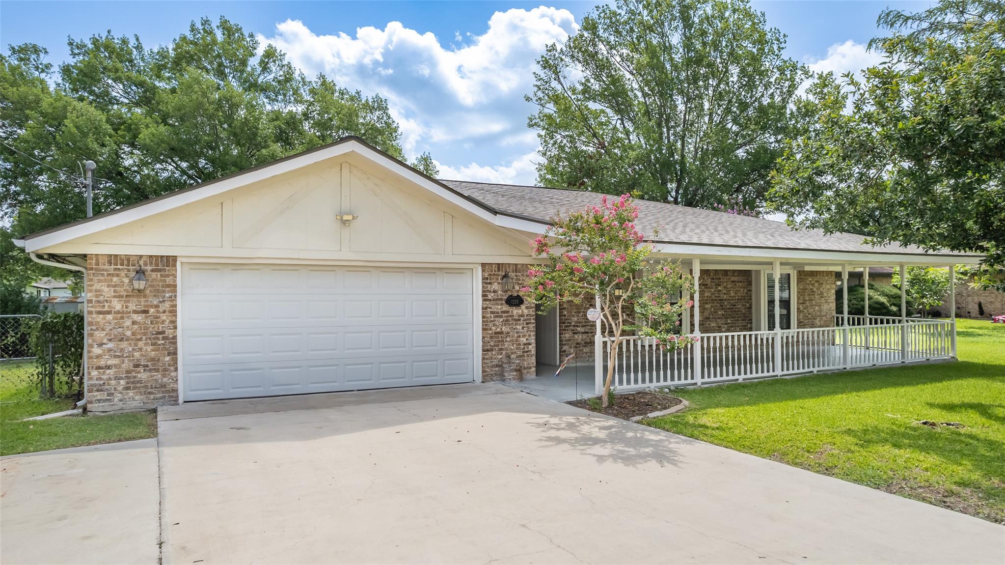 A well-maintained single-story home with a wide d