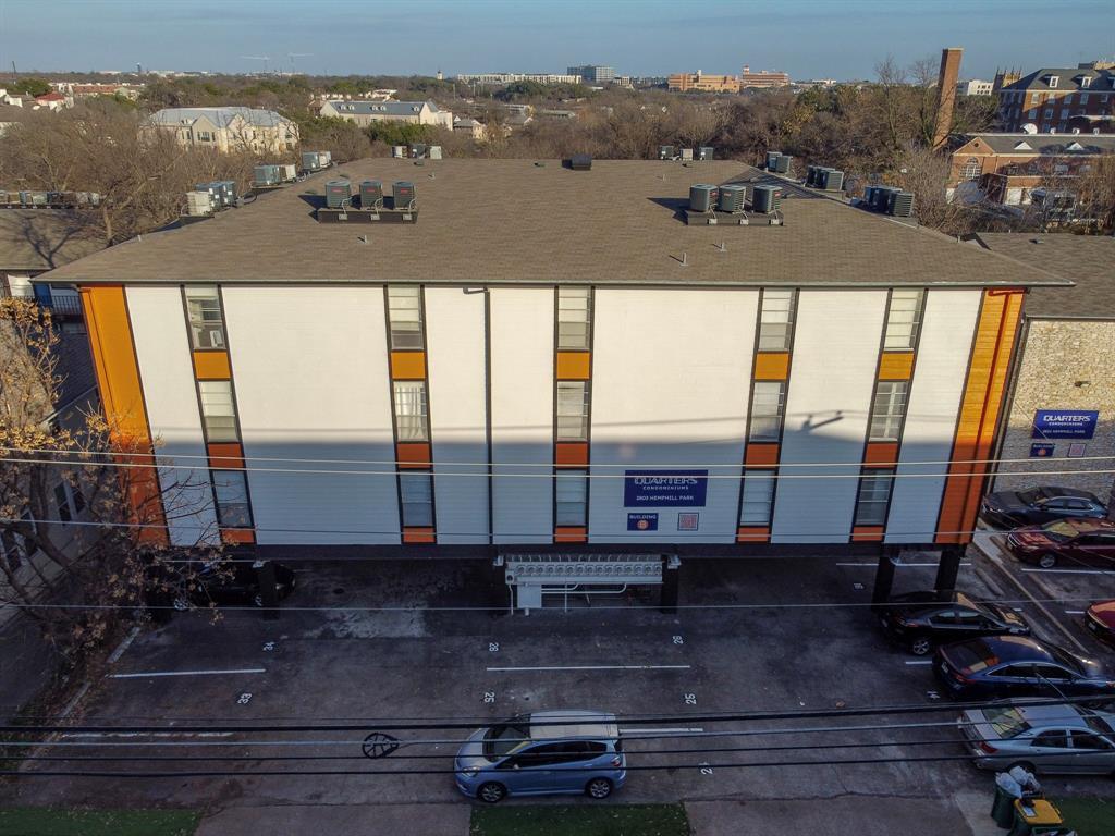 A striking modern facade with ample parking, perf