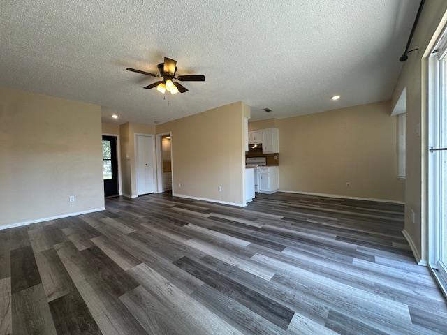 A spacious common area with attractive flooring a