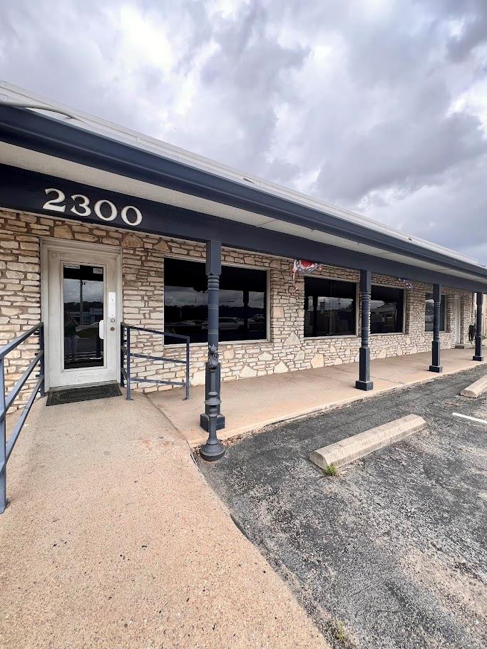 A commercial facade featuring stone construction 
