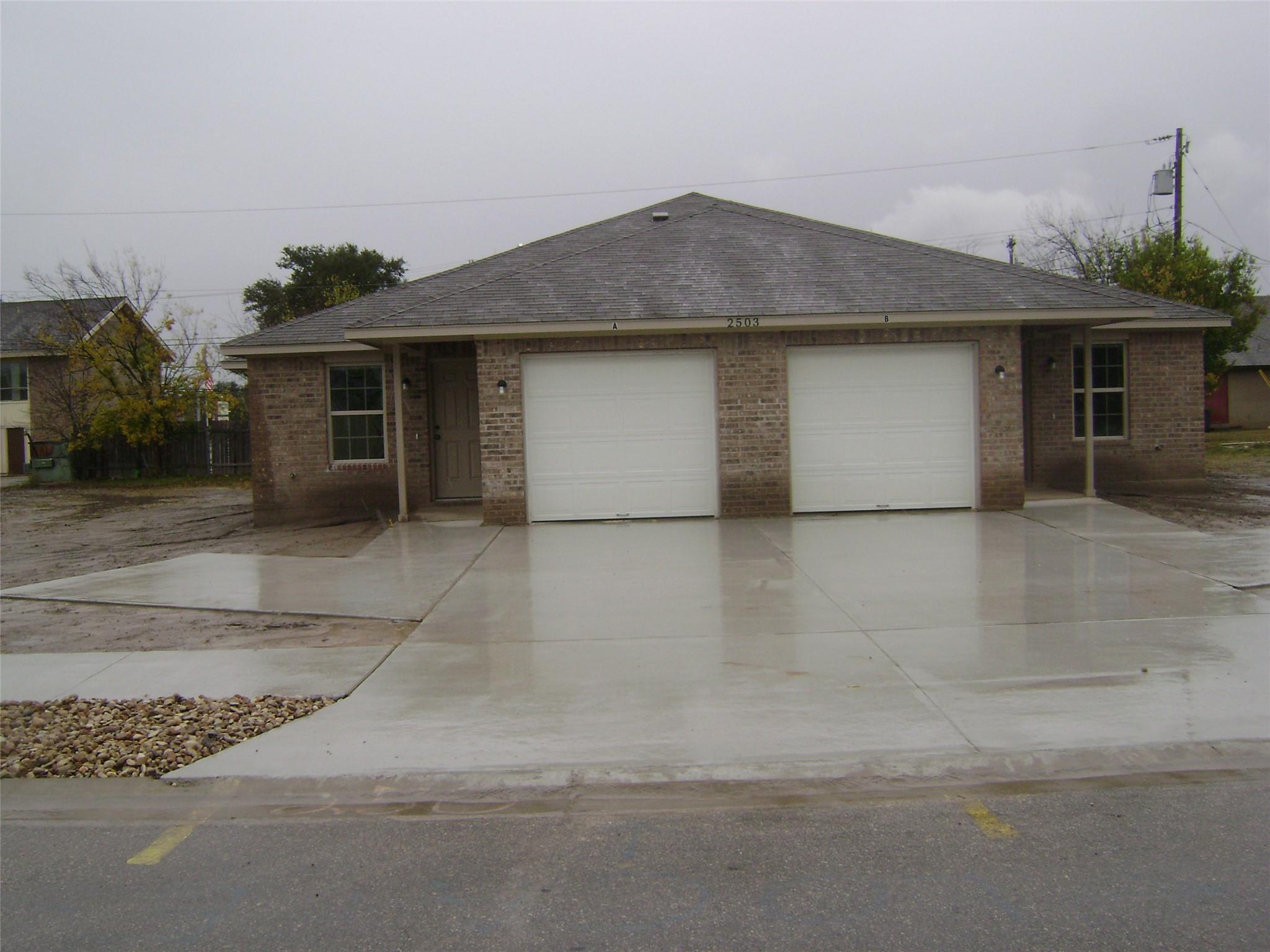 Two individual garage bays and expansive concrete
