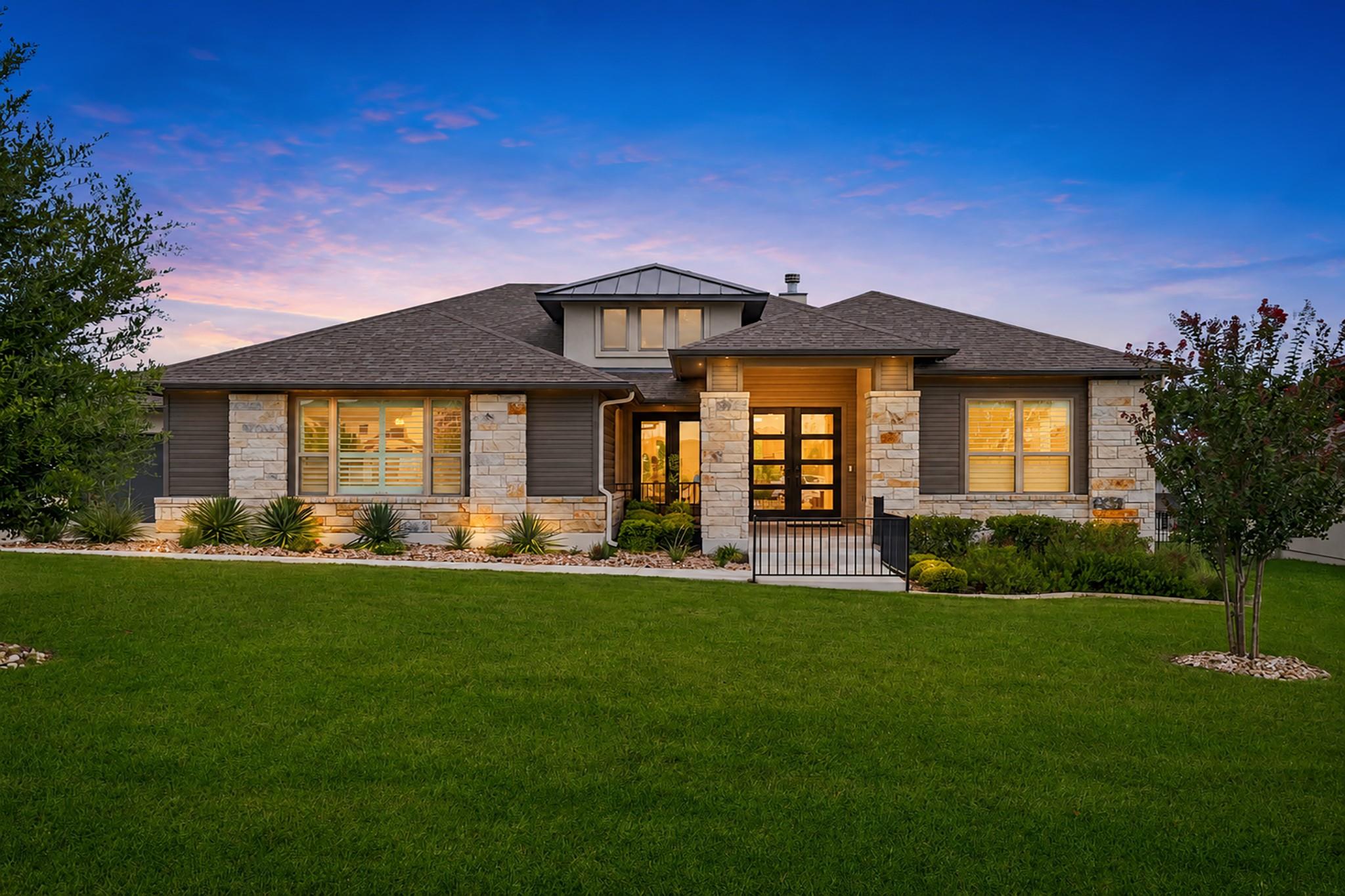 The striking facade of this home features a blend