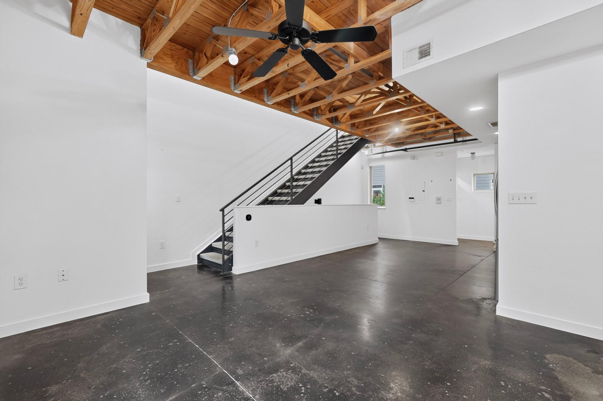 Exposed wood beam ceilings and polished concrete 