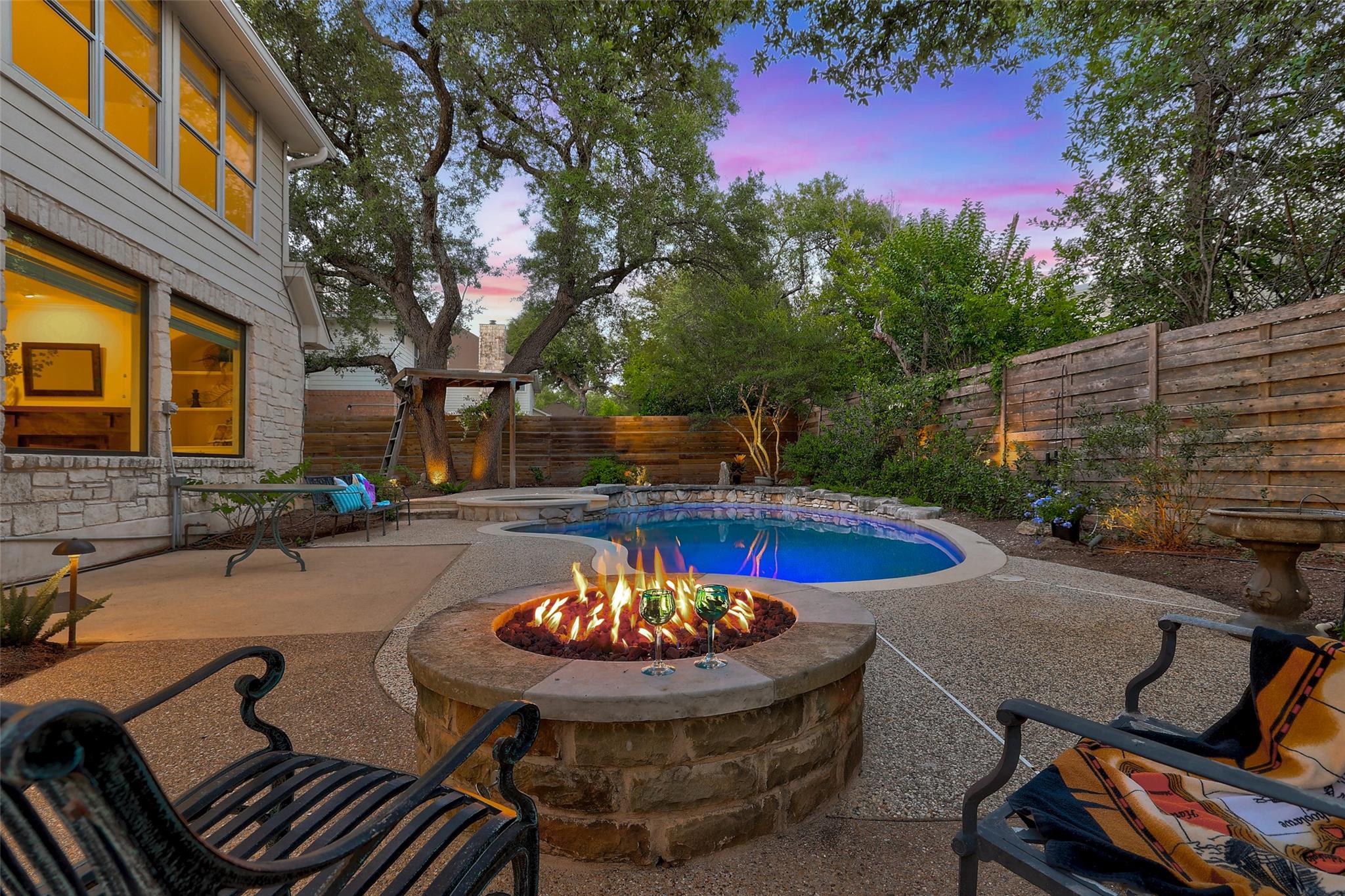 An inviting backyard oasis offers a sparkling poo