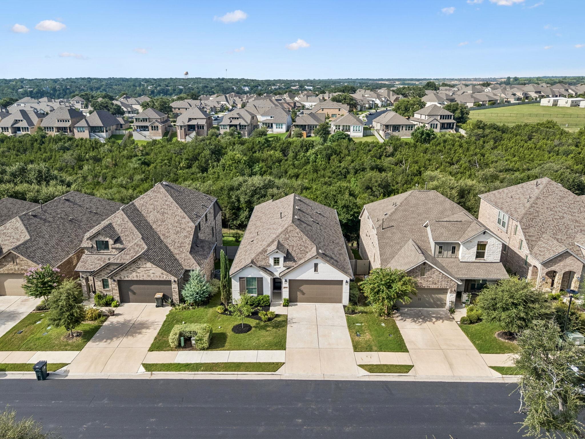 An aerial perspective reveals a row of homes with