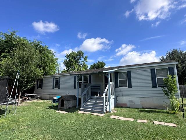A well-maintained single-story home with a inviti