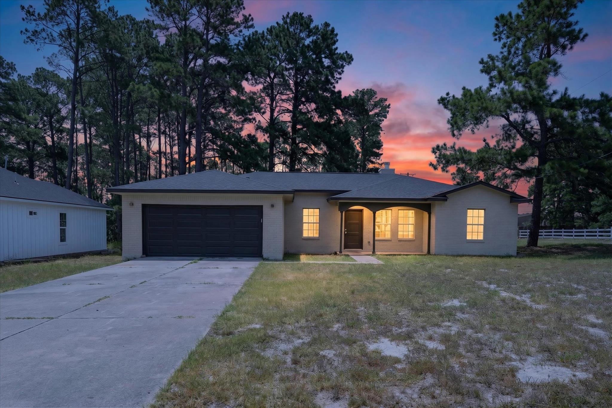 A welcoming front porch invites you into this cha