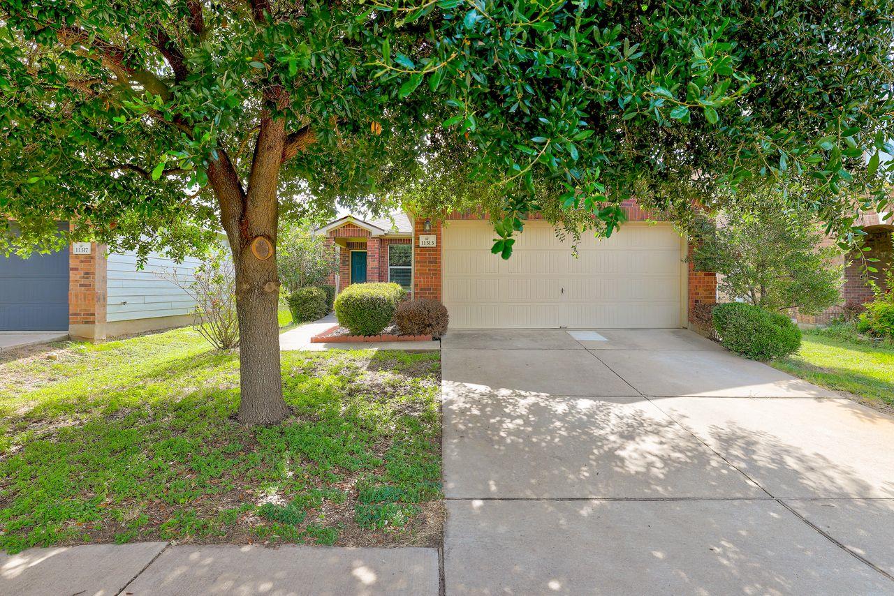 A well-maintained front yard welcomes you to this