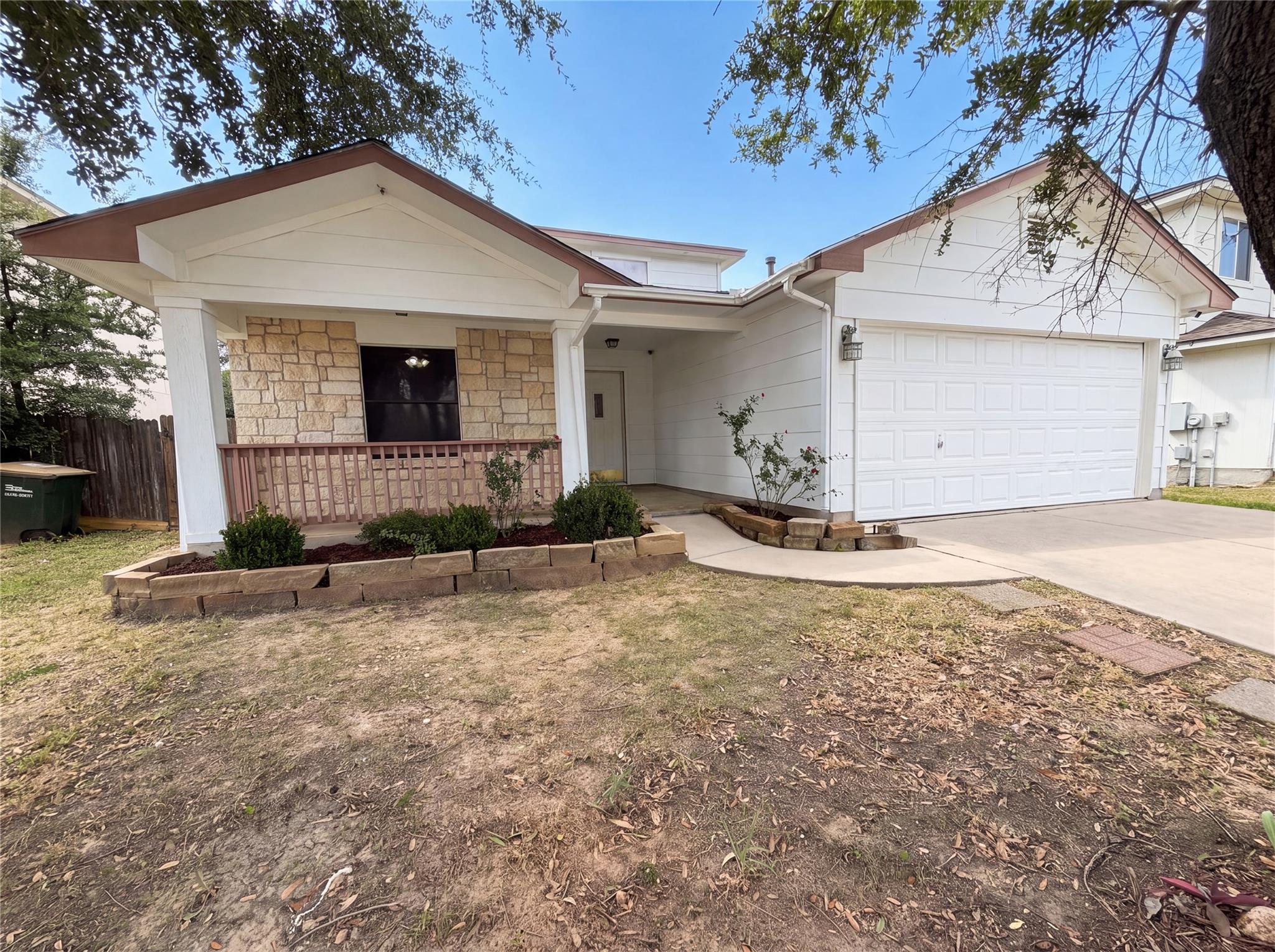 A welcoming facade features a covered front porch