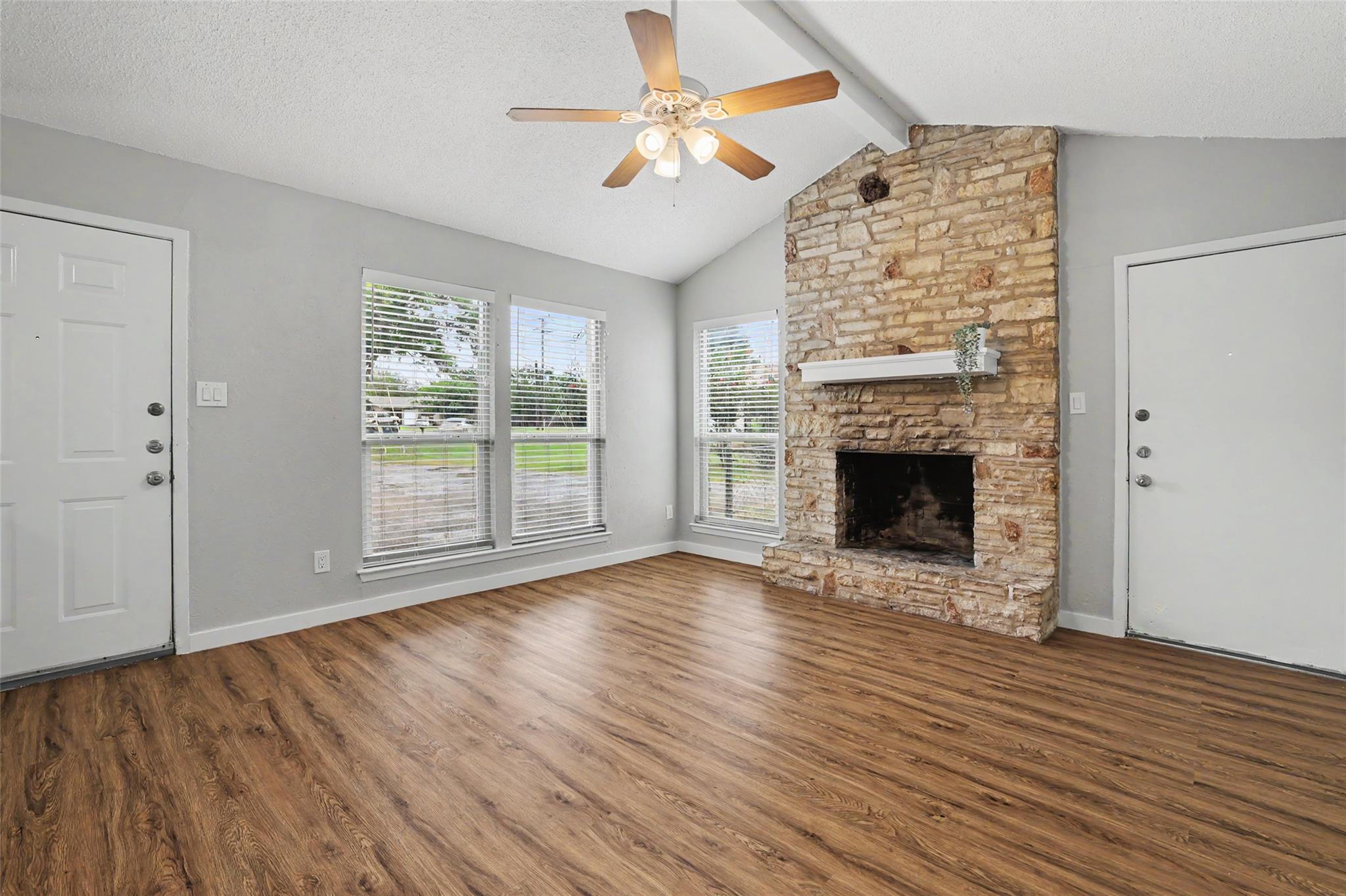 A welcoming living area offers rich wood flooring