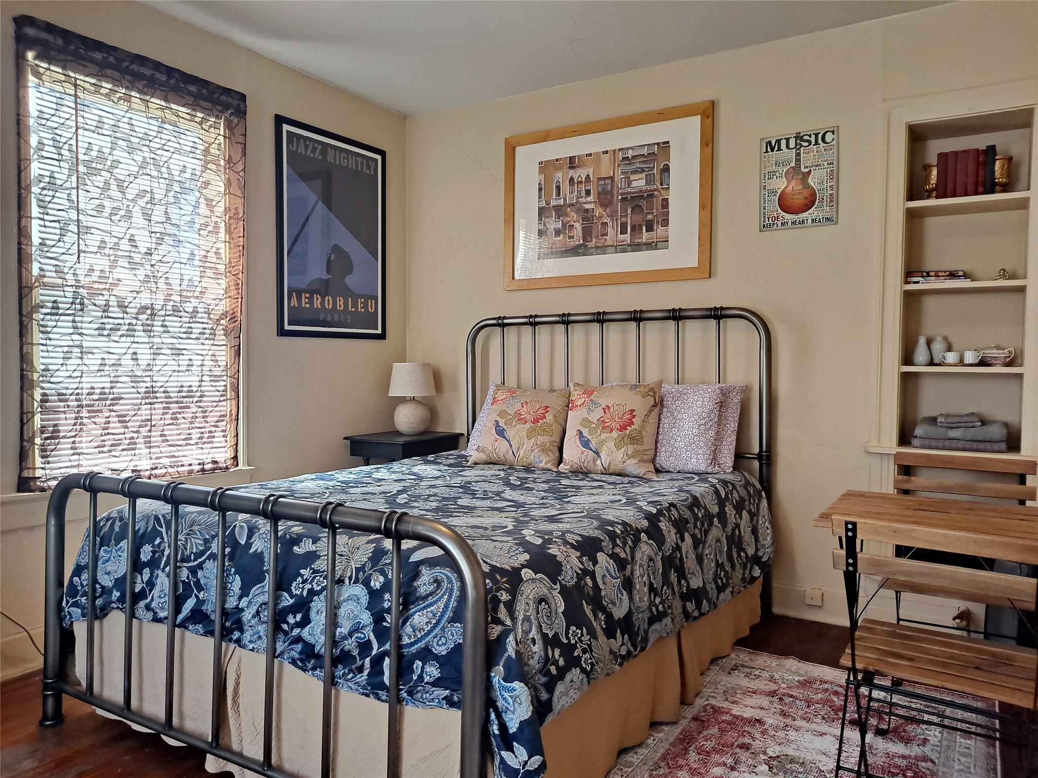 Hardwood floors and built-in shelving define this