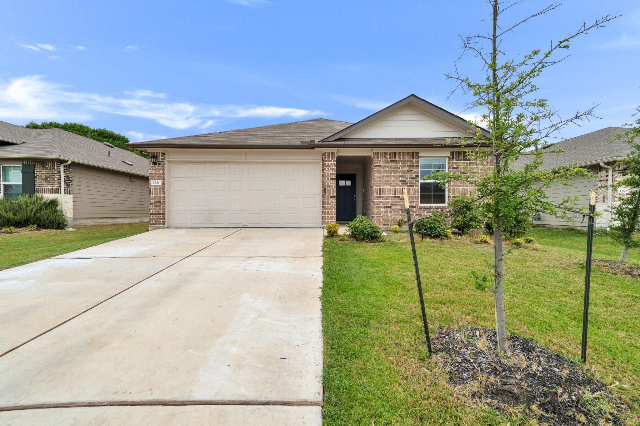 A well-maintained lawn welcomes you to this singl