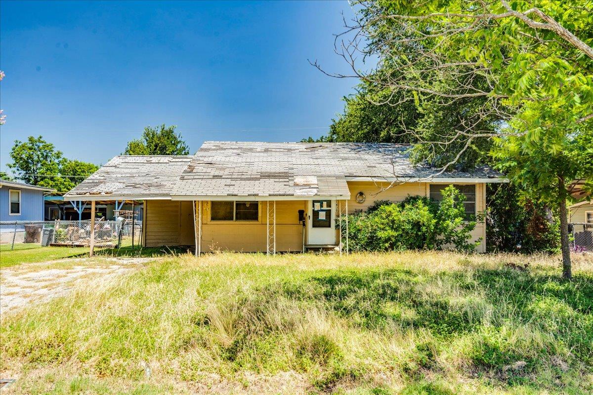 A modest dwelling awaits transformation, nestled 