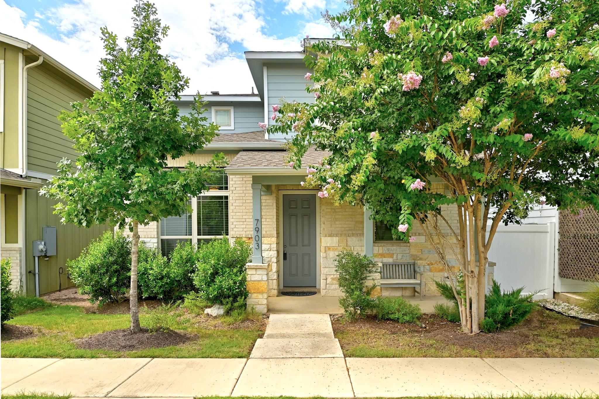 A welcoming front exterior showcasing stone and s