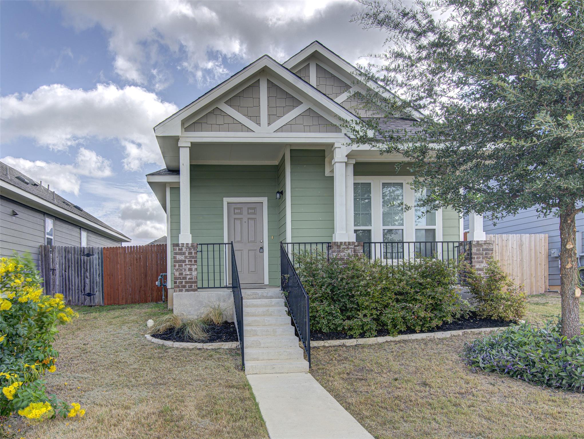 A welcoming facade with a covered porch and neatl