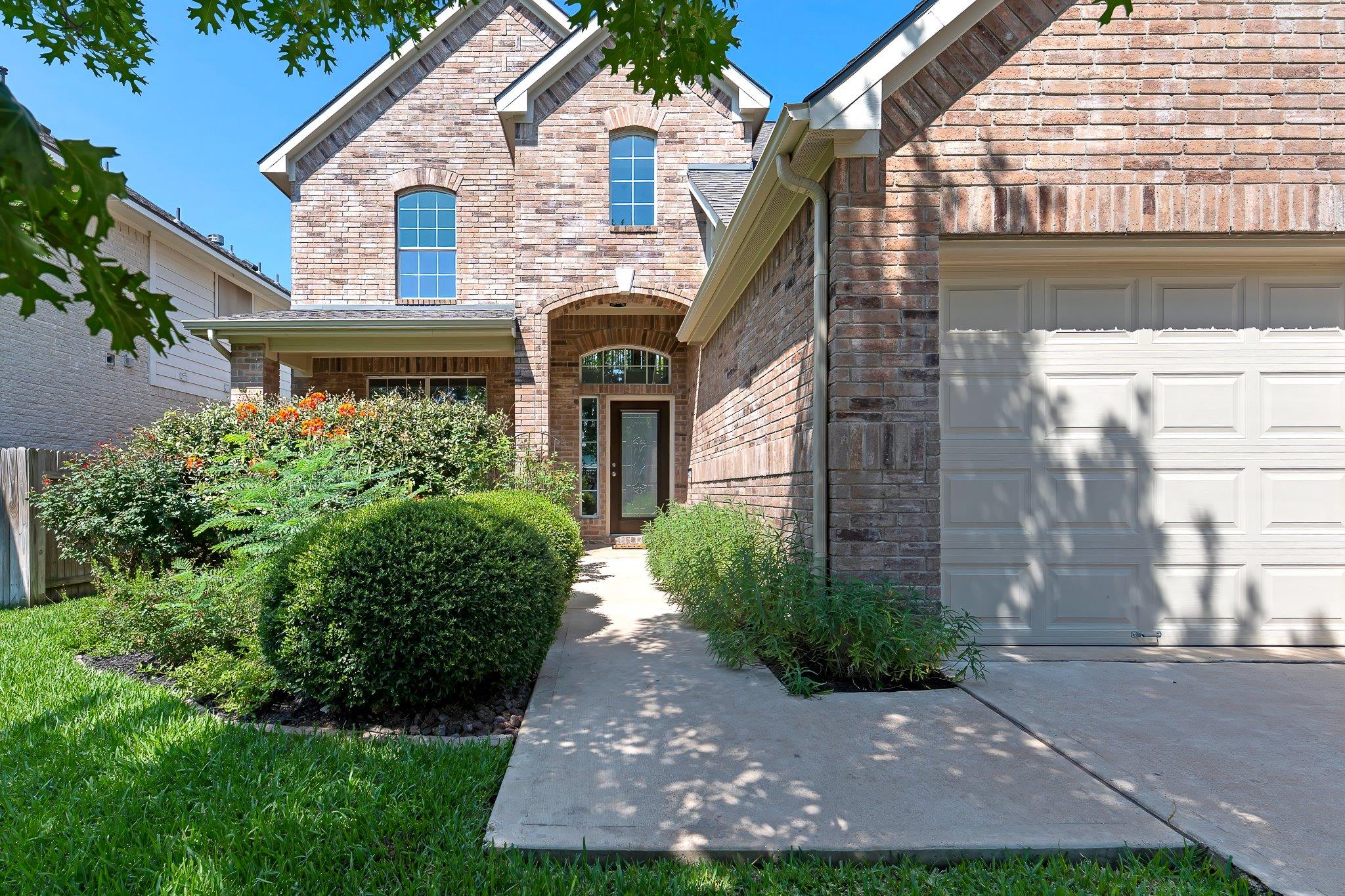 A well-maintained brick exterior with arched wind