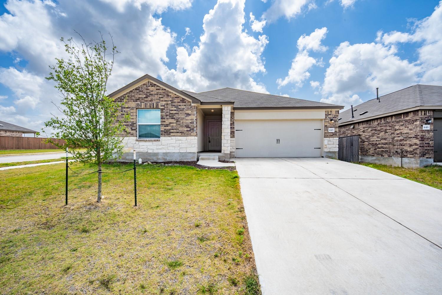 A well-maintained lawn welcomes you to this attra