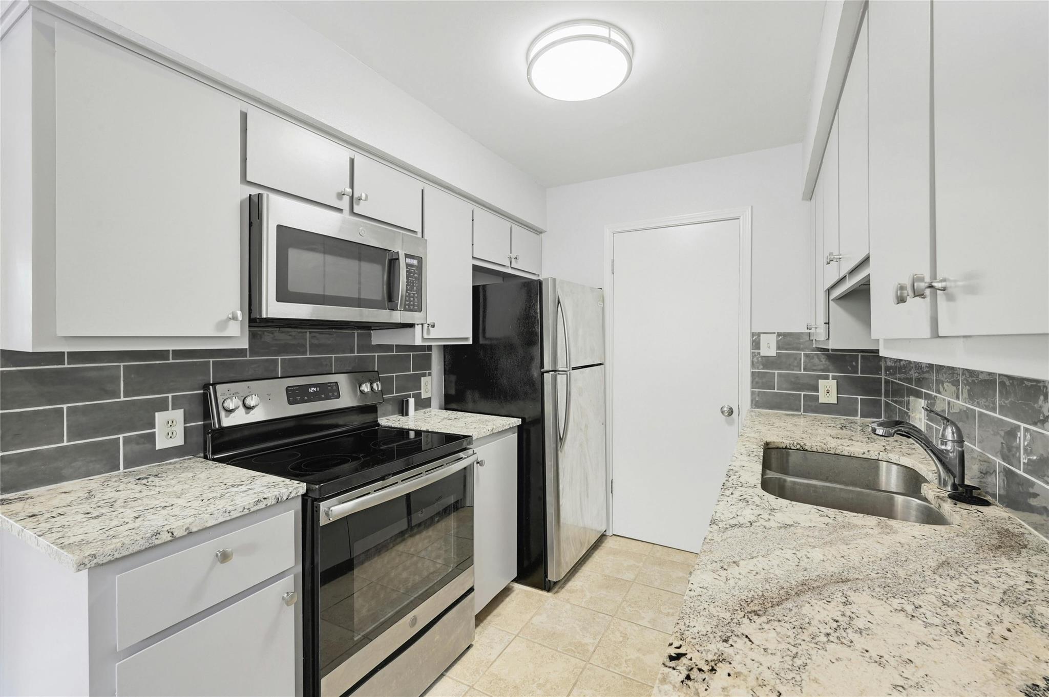 Culinary delights await in this modern kitchen, f