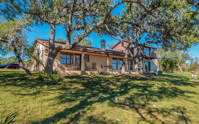 Mature trees shade this charming residence with a
