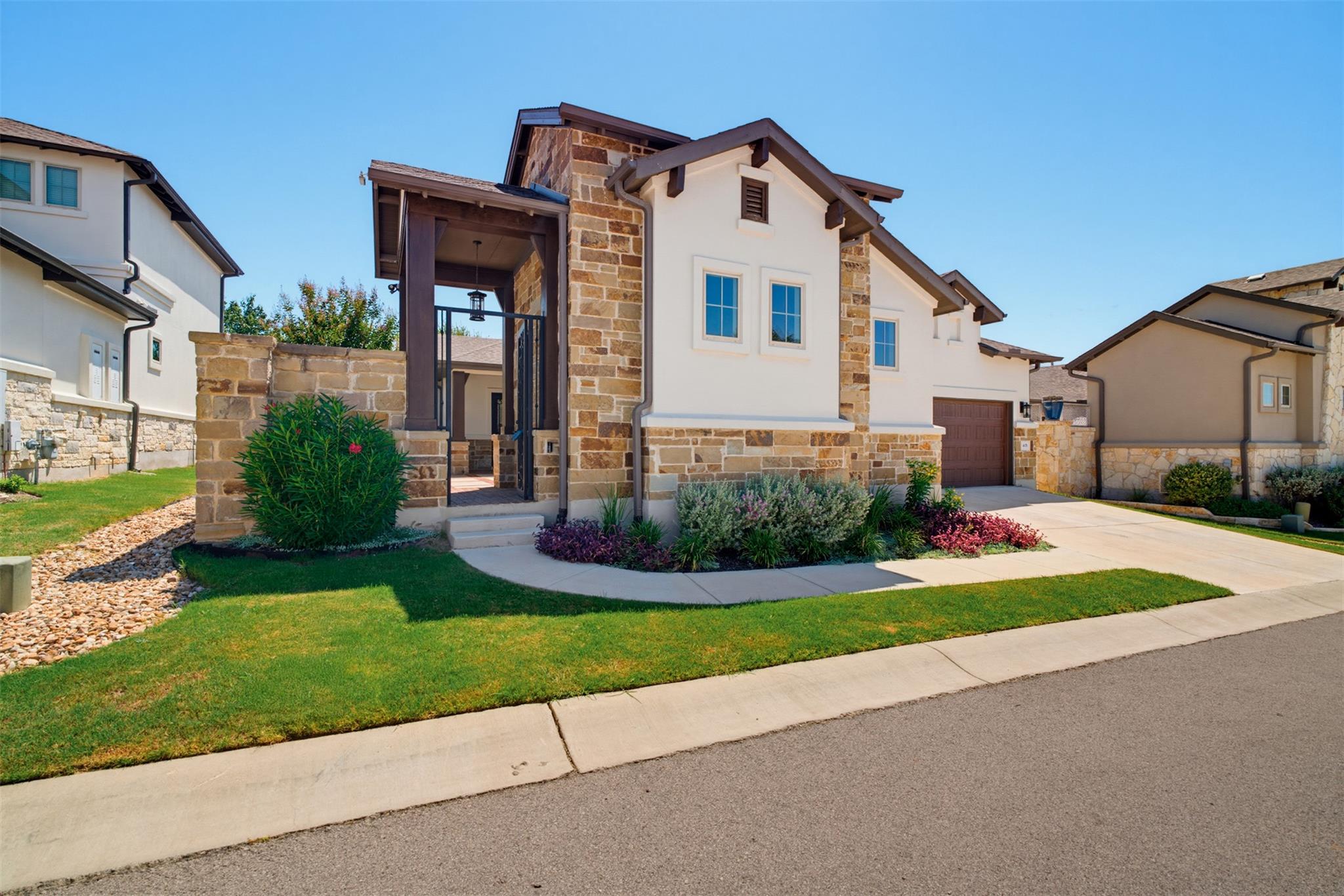 A well-maintained lawn and verdant landscaping in