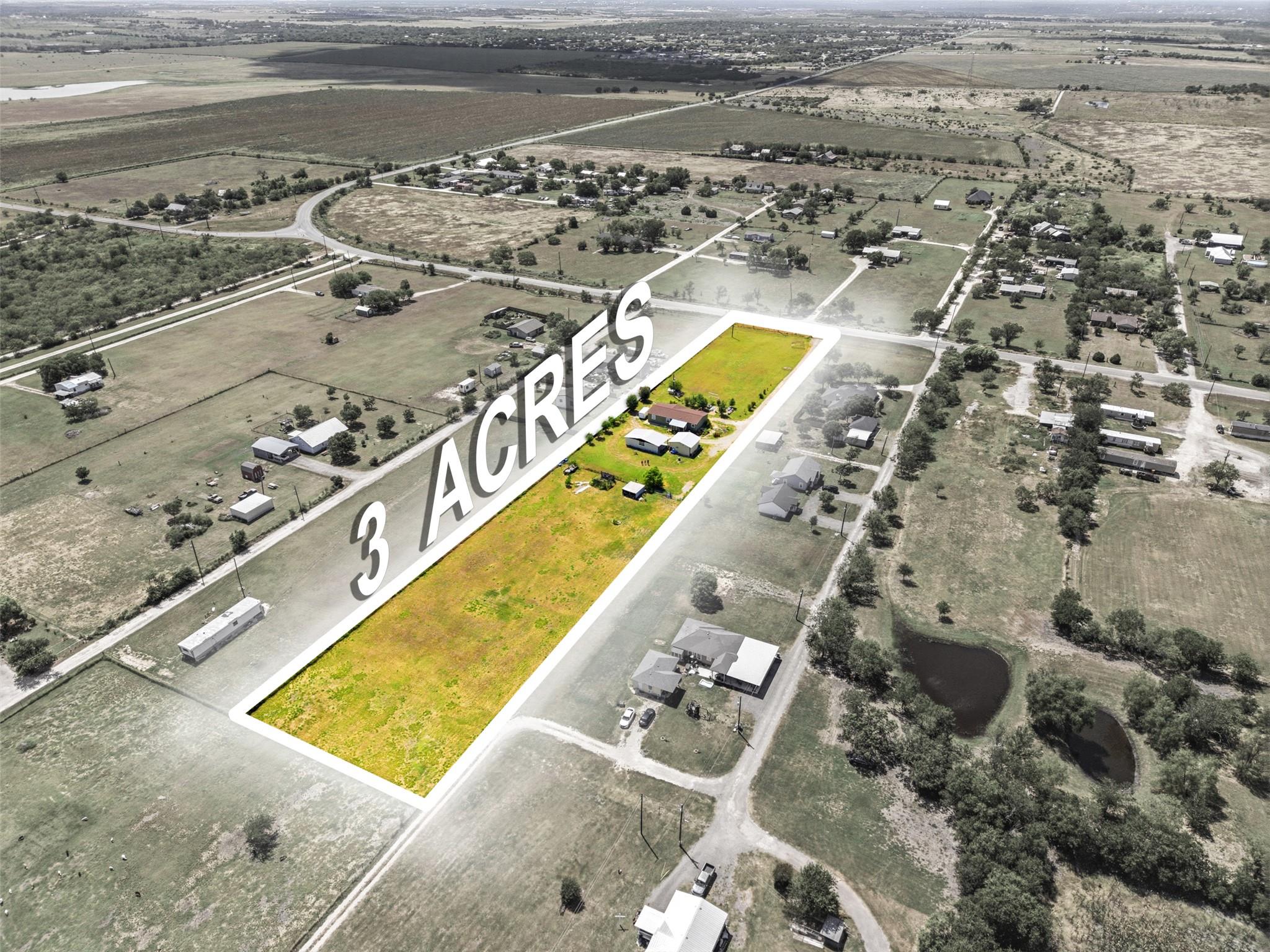 A vast, open three-acre parcel provides an excell