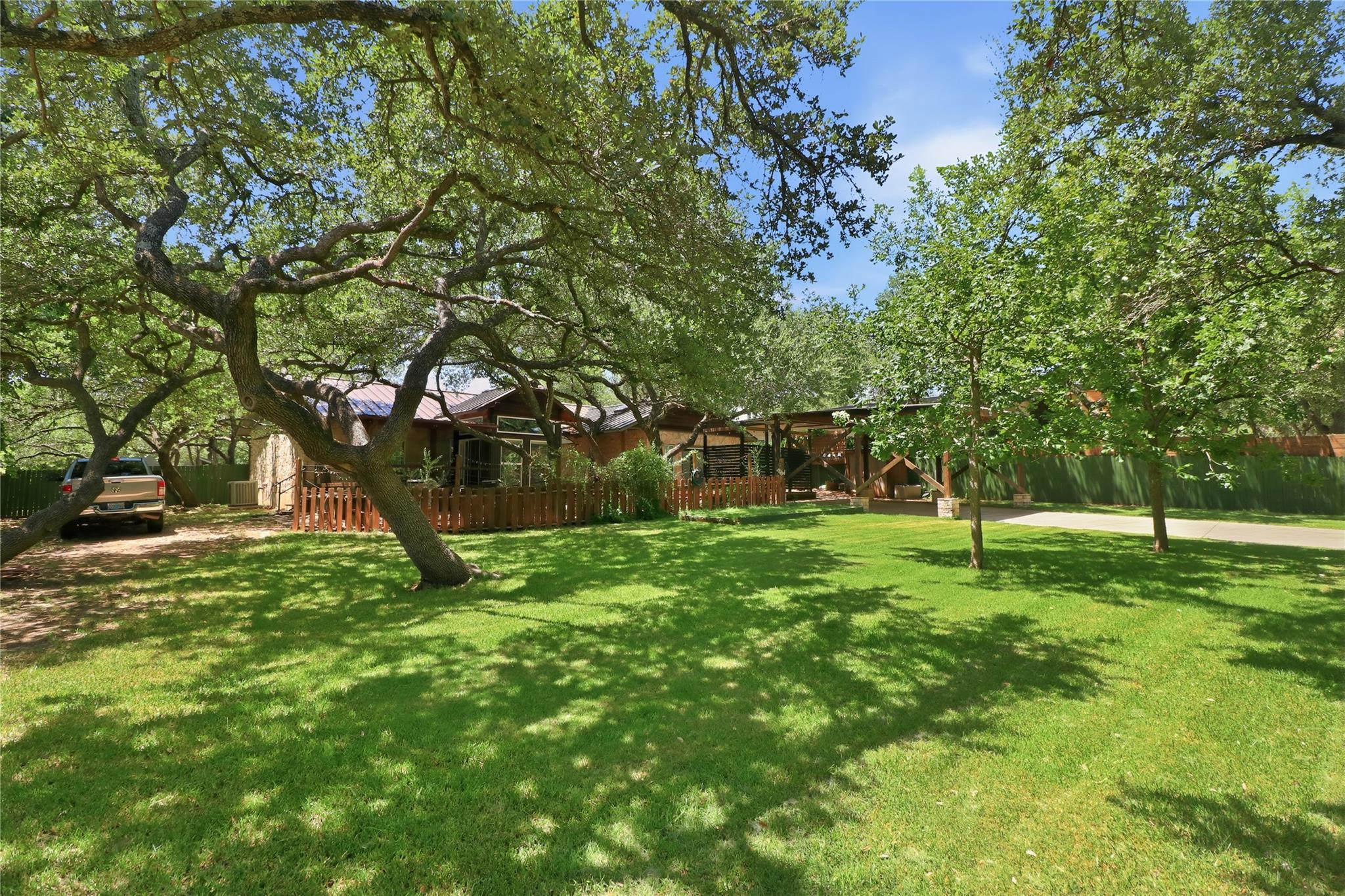 Mature trees shade this inviting single-level hom